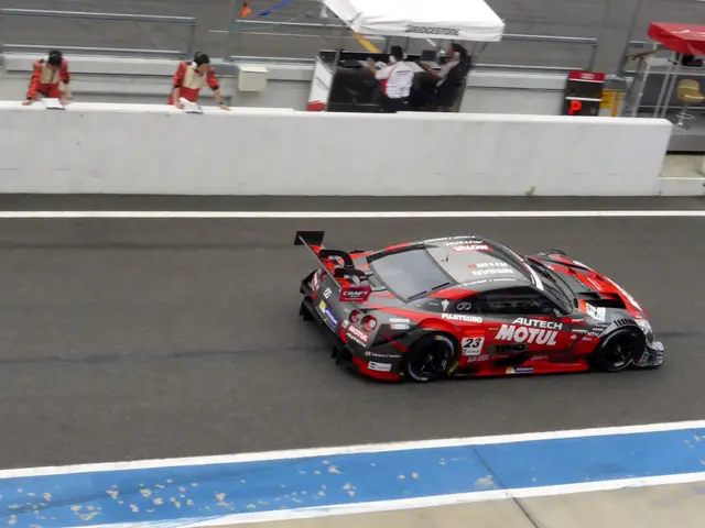 The image shows a Nissan GT-R Nismo GT3 on the racetrack at Daytona Beach, with a wall in the...