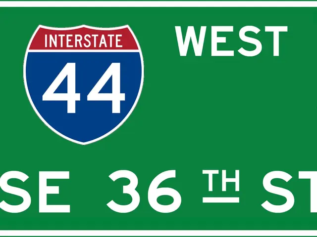 The image shows a green highway sign with the words "Interstate 44 West" and an arrow pointing to...