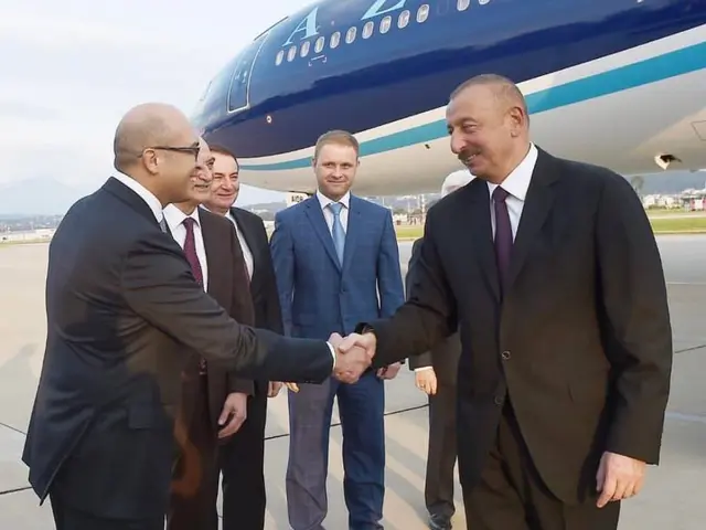 The image shows Azerbaijani President Ilham Aliyev and Turkish President Recep Tayyip Erdogan...