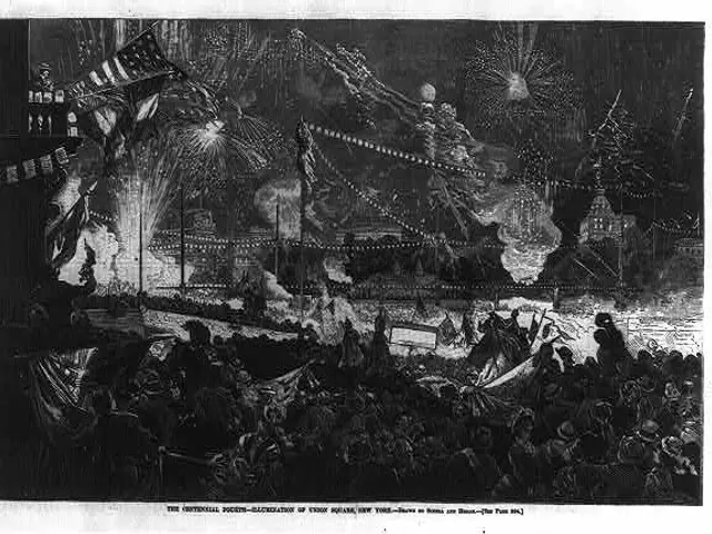 The image shows a black and white drawing of a crowd of people gathered around a firework display,...