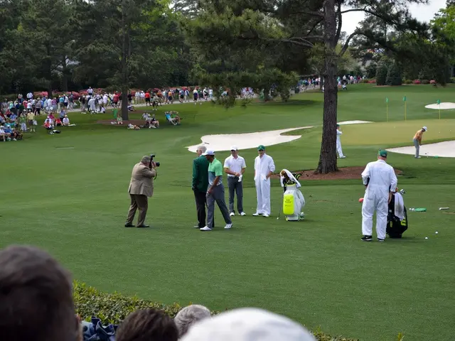 In this image there are a few people playing golf on the golf course, besides them there are kits,...