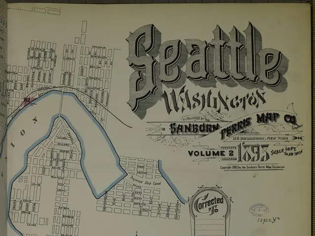 The image shows an old book with a map of Seattle, Washington on it. The map is detailed and shows...