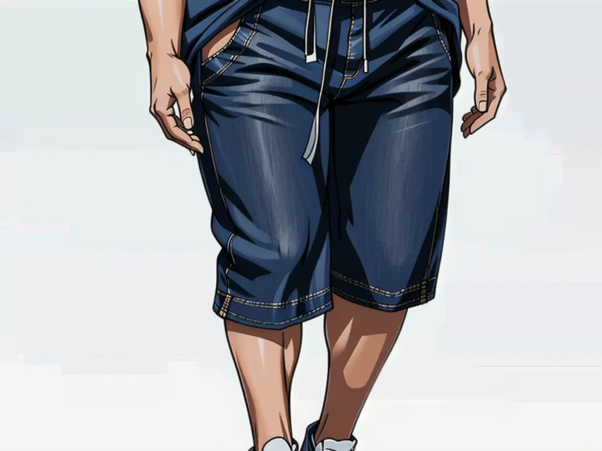 Individual sporting a denim mid-length skirt and white sneakers in sight. Individual sporting a denim mid-length skirt and white athletic shoes