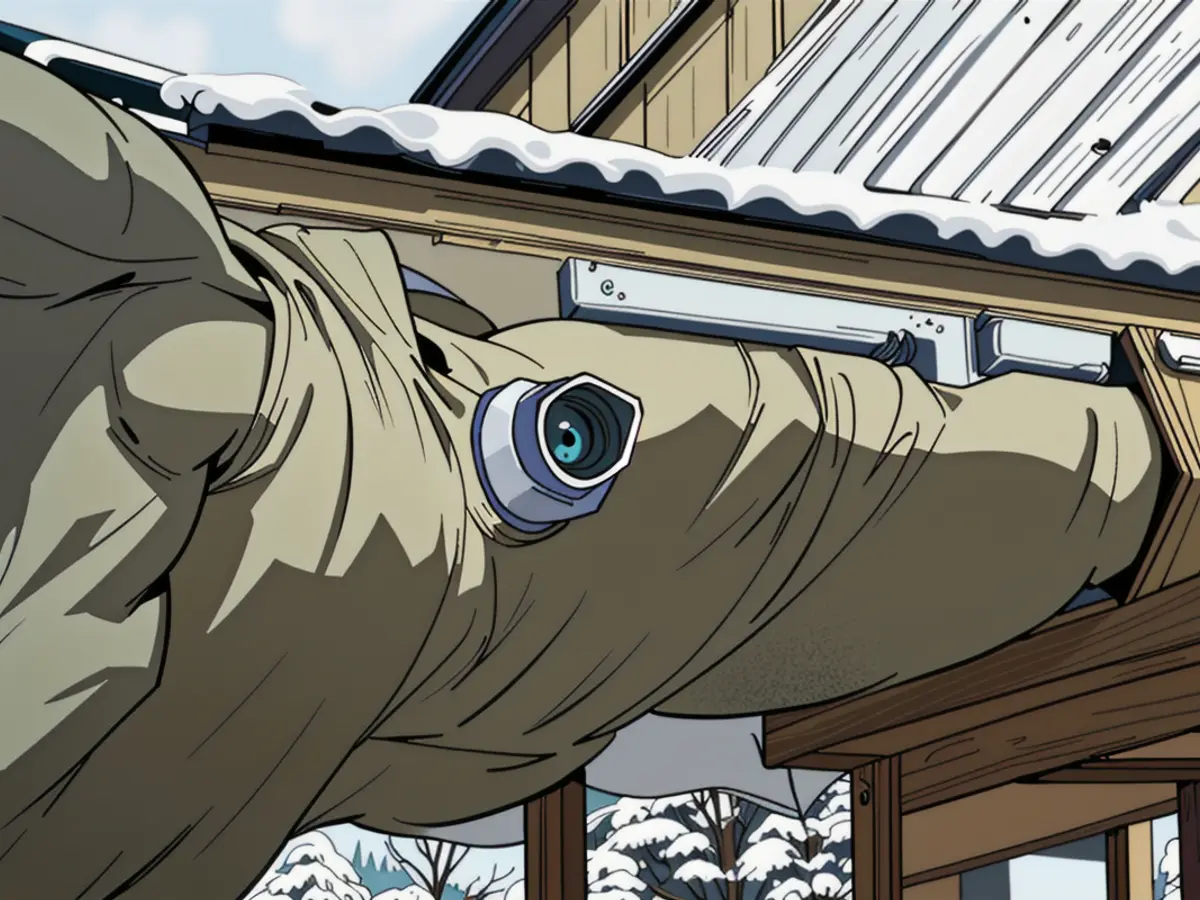 Security camera situated on a home's roof eave endures winter season Surveillance camera positioned on a house's roof edge during cold season