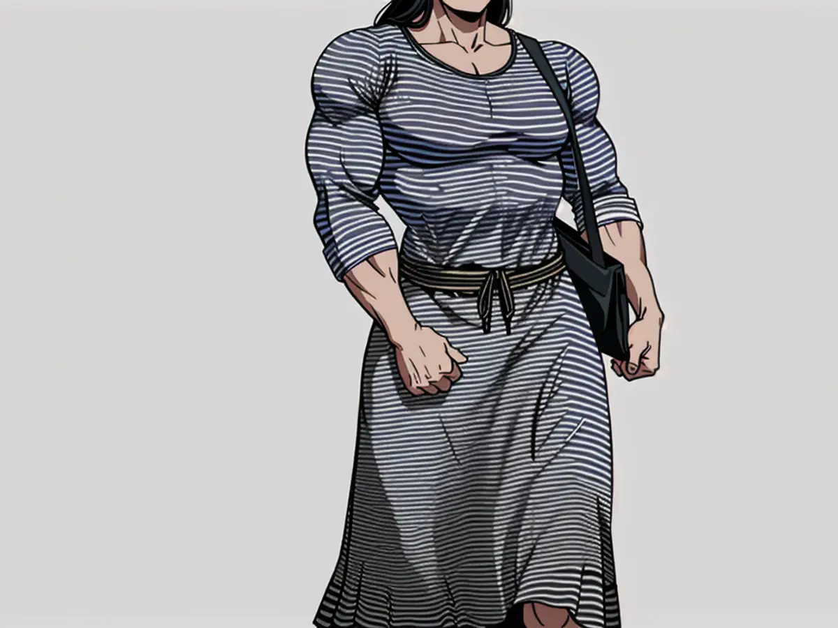 Shopper in a lengthy, horizontal-patterned dress and black footwear, carrying a dark sack, displayed for a retail piece. Model posing in a long striped dress, black flats, and carrying a black bag for a shopping feature.