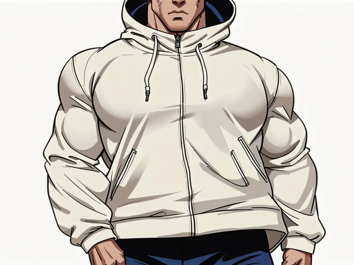 A person sporting a cream-hued hoodie jacket is in the spotlight. A person donning a hooded cream-colored jacket appears in the scene.