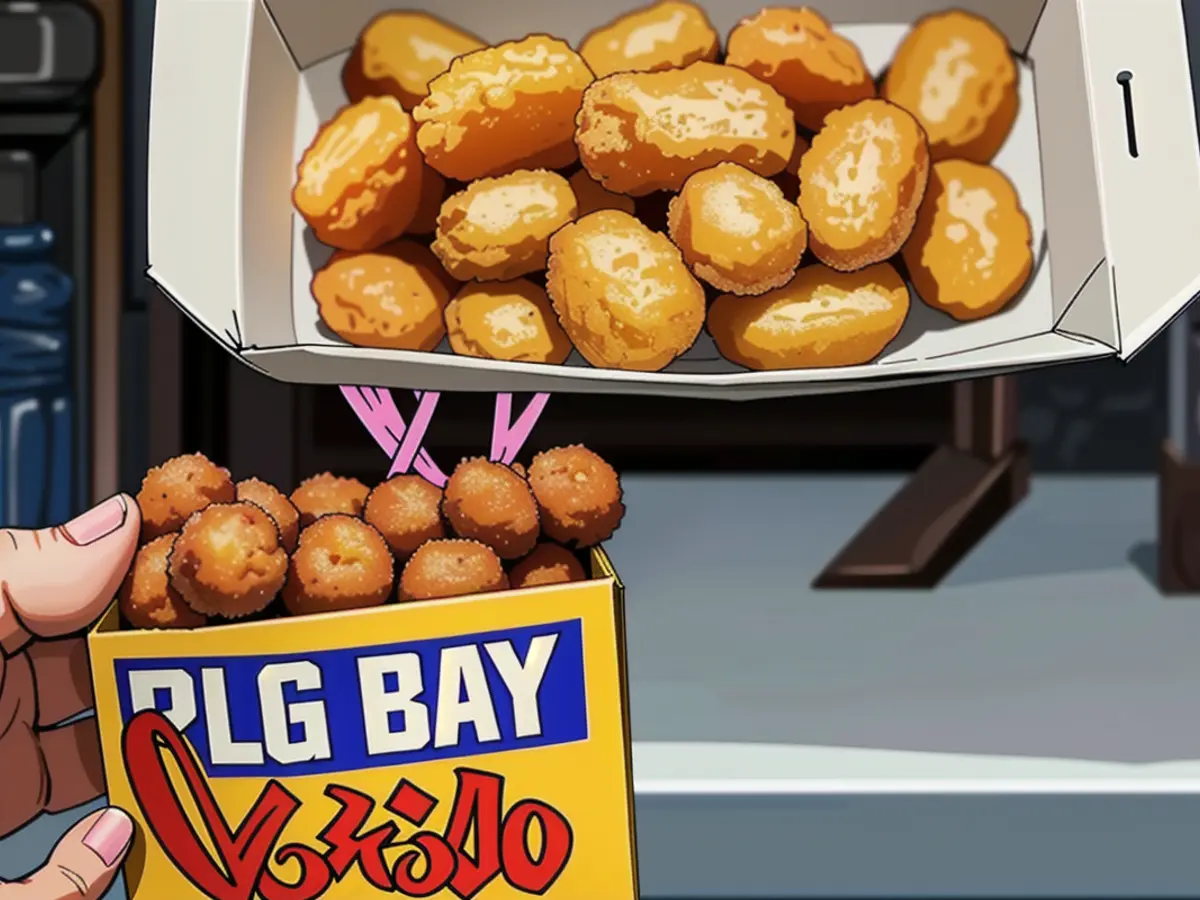 Image featuring a user displaying Old Bay seasoning container next to a box of tater tots in the foreground. Image showing reviewer proudly displaying Old Bay seasoning alongside tater tots in a casual setting