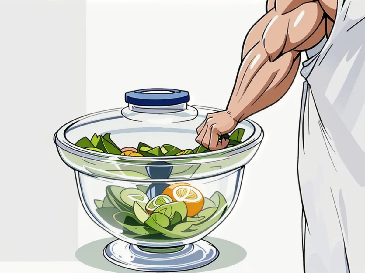 Person using a salad spinner in photo Person Photographed While Utilizing a Salad Spinner