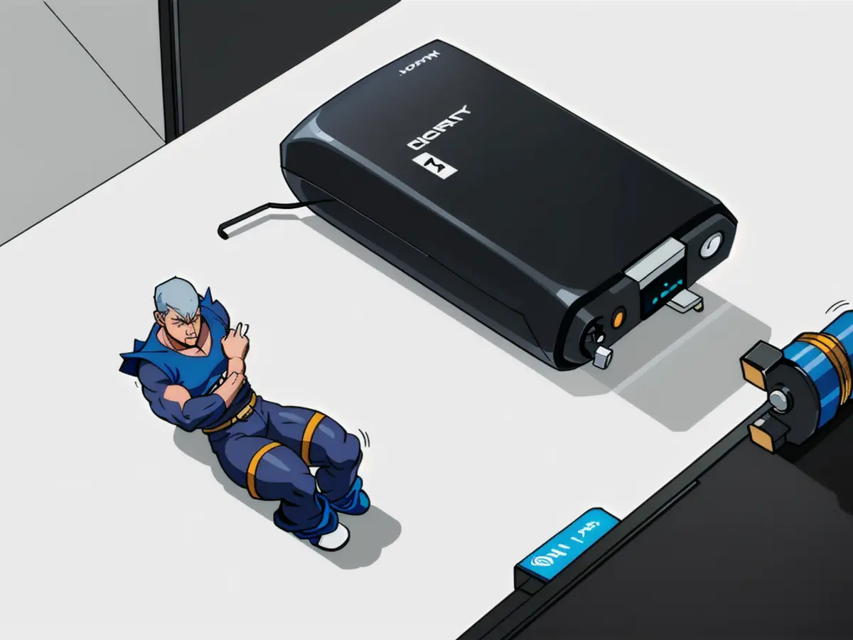 Black power bank with a cord and mesh pouch, accompanied by a rectangle shape, rests nearby.