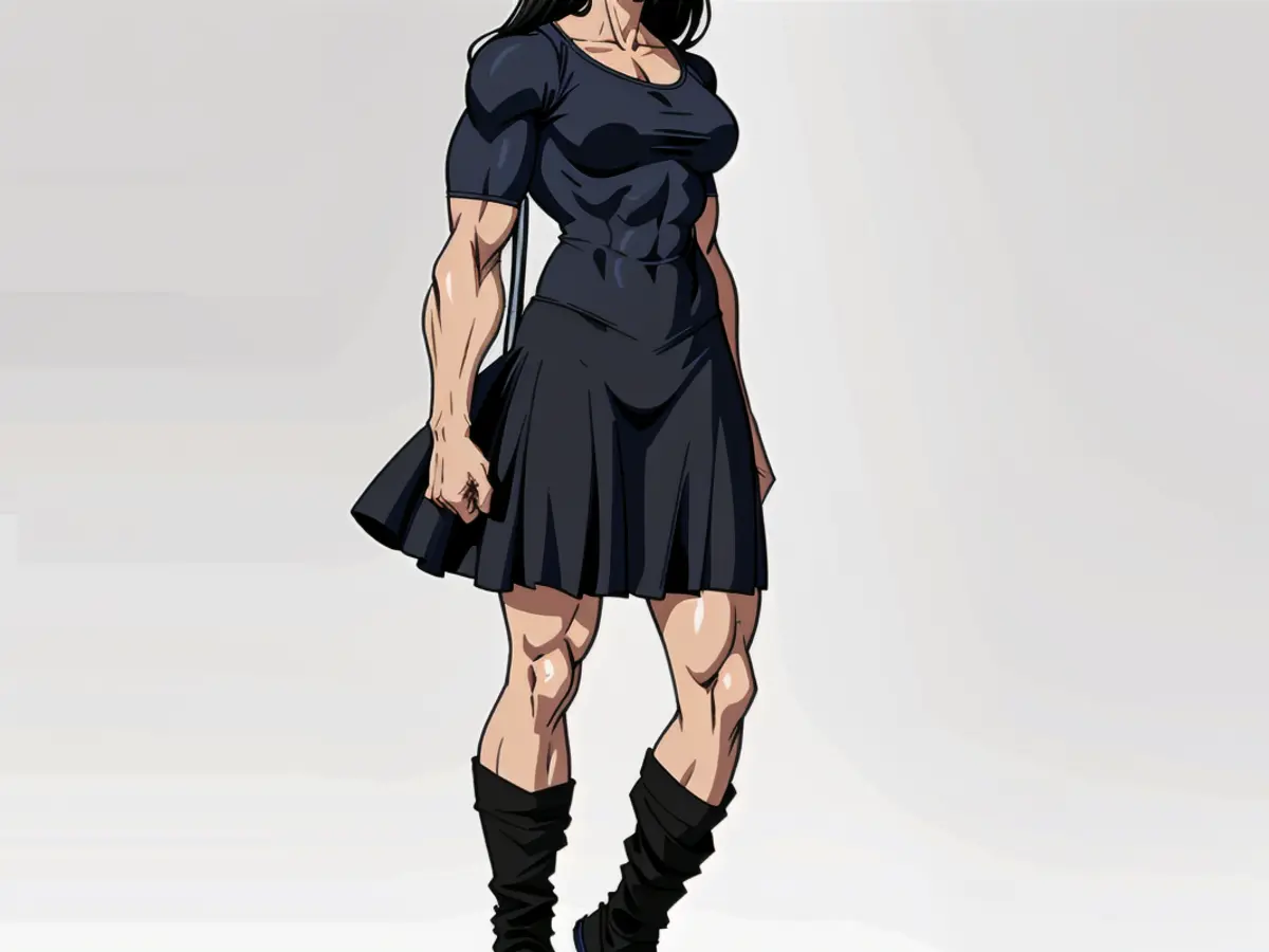 Black dress with a mid-thigh length on fashion runway model
