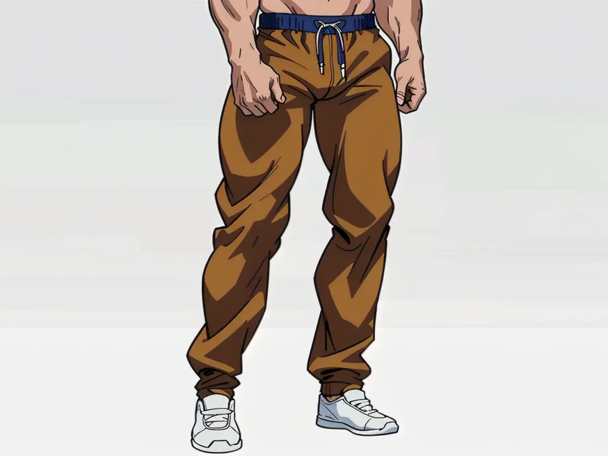 Individual sporting casual brown jogger trousers Individual sporting casual attire, specifically brown jogger pants.