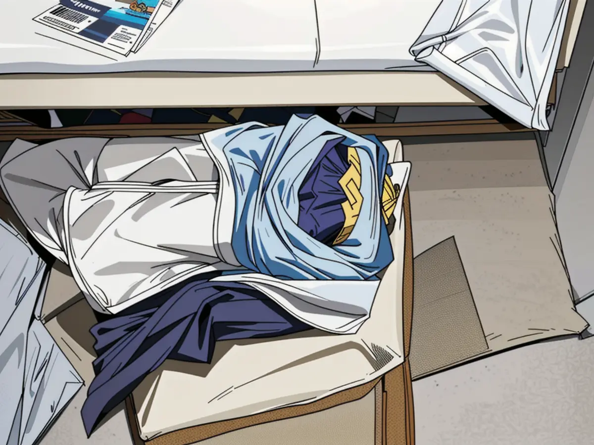 Clothing-stuffed storage bag discovered near a resting bed Clothes-stuffed sack found near a mattress