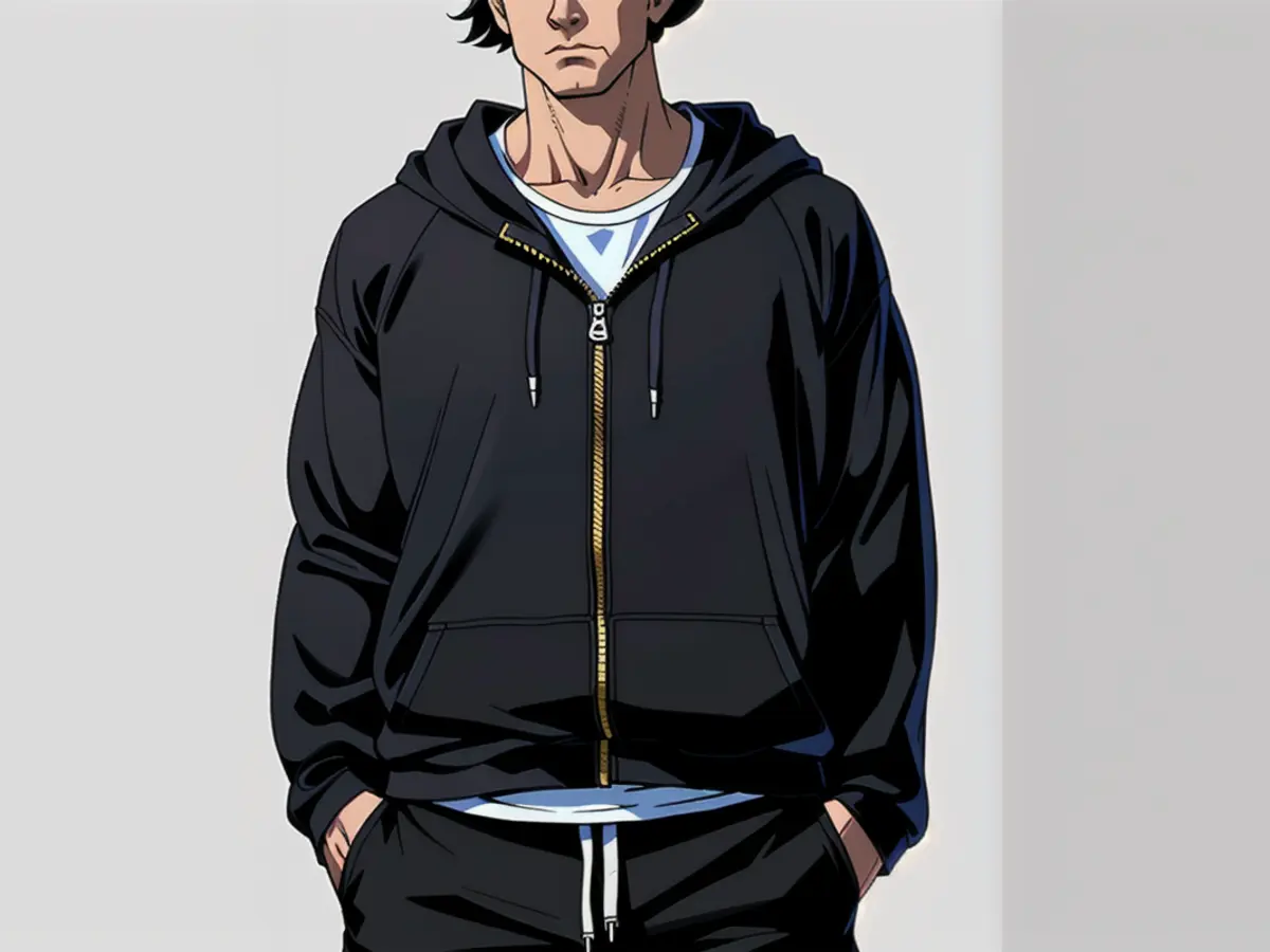 Black zip hoodie modeled in standard clothing attire. Black zip-up hoodie featured on model's attire