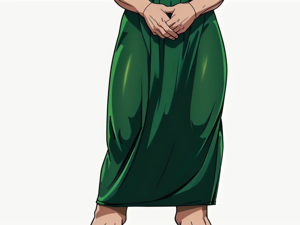 Woman in green tight ensemble with folded shoulder details. Woman in emerald-green gown featuring draped shoulders and a fitting silhouette.