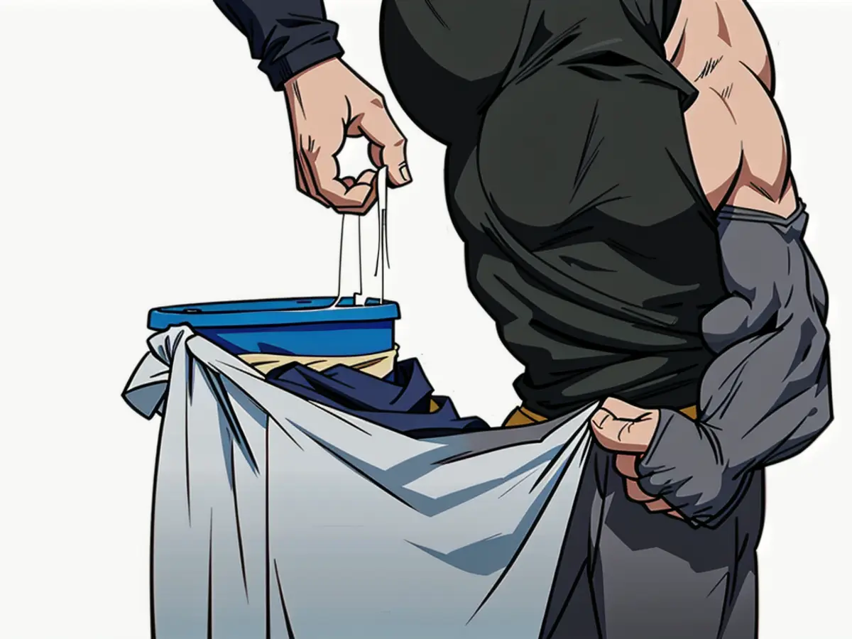 Person retrieving garbage bag