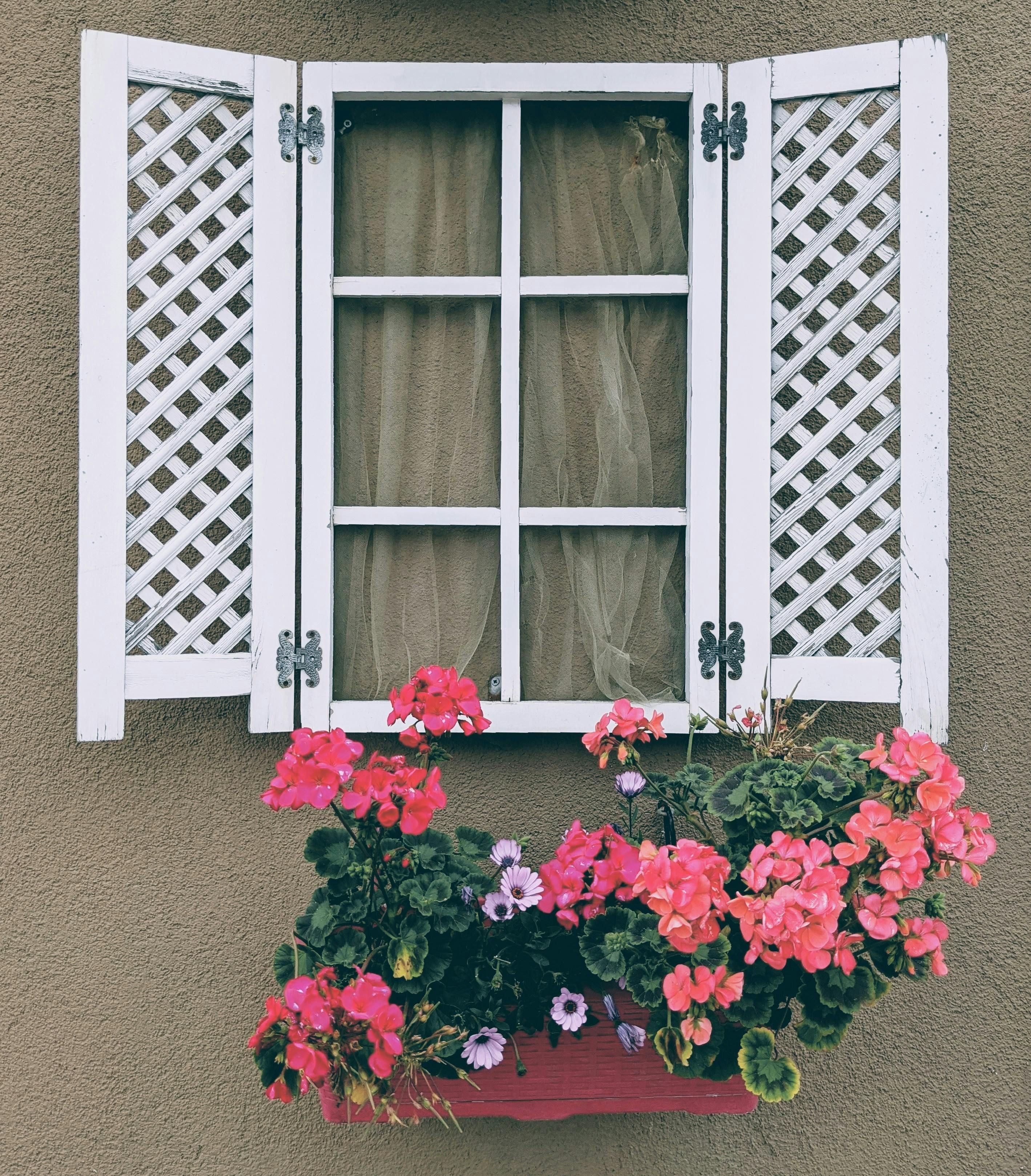 Reclaimed wood lattice planters filled with an assortment of blooming flowers, perfect for outdoor cultivation projects Handcrafted timber flower boxes filled with a variety of blooming plants, suitable for outdoor container gardening