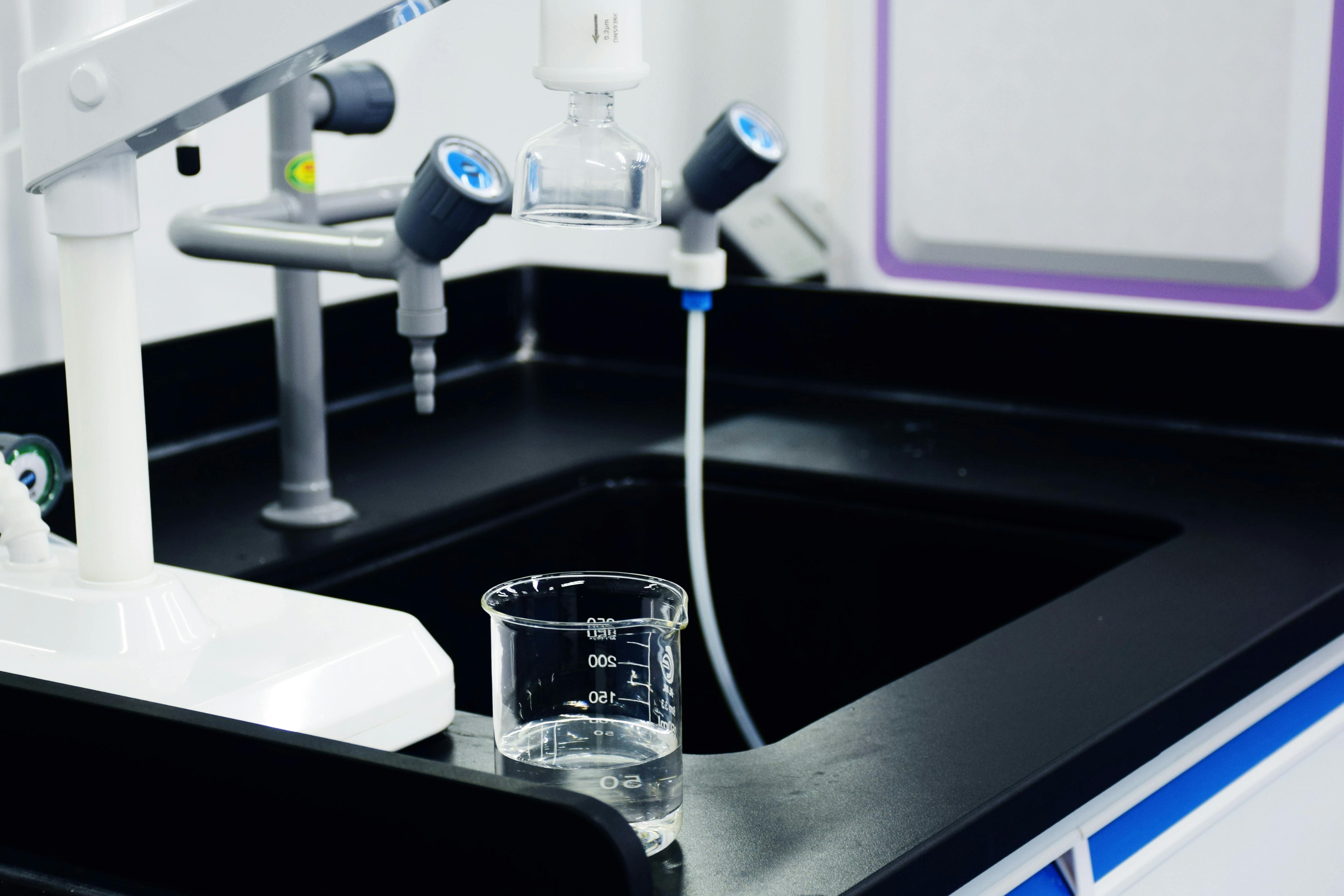 Re-worded description: Filtered Water from a White Faucet-Attached Device