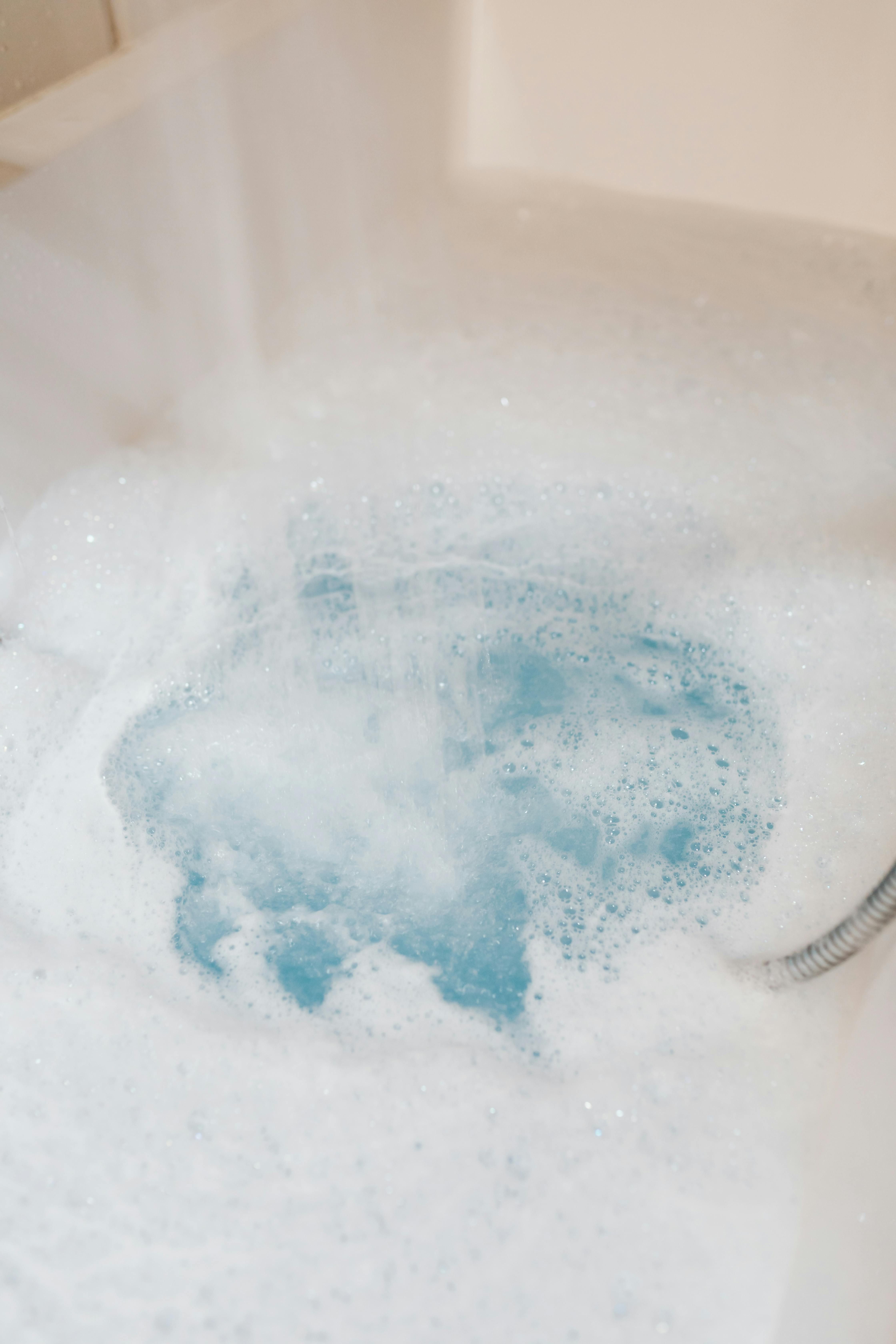 Expert evaluator's basin overflowing with foaming blue substance. Reviewer's Sink Overflowing with Blue Foam Mass