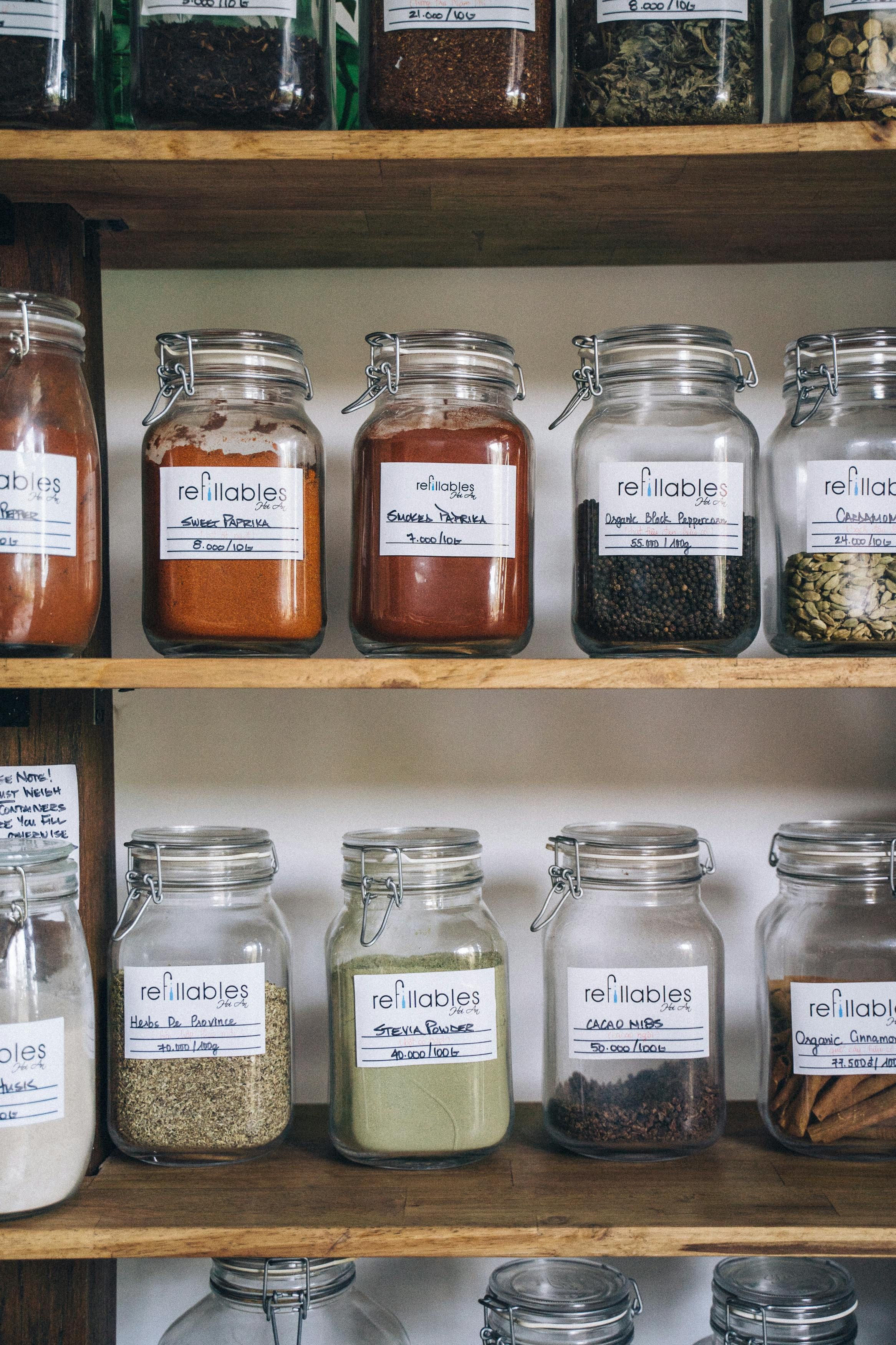 Fridge adorned with multiple spice jars made of glass, as depicted in the reviewer's image. Image depicting a collection of glass spice jars adhered to the refrigerator's surface