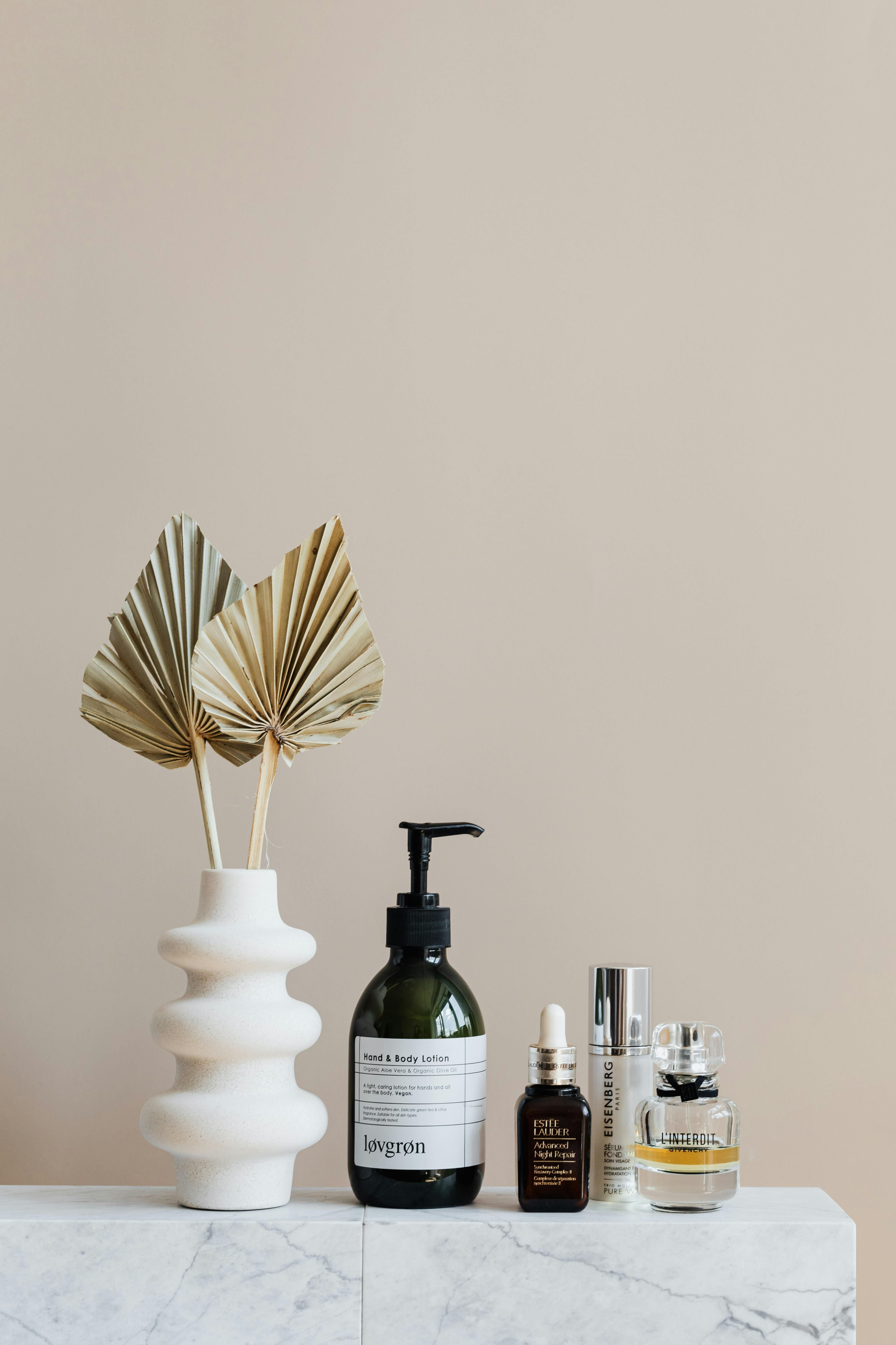 Bathroom shelf stacked with assorted personal care items. Bathroom shelf filled with toiletries on display
