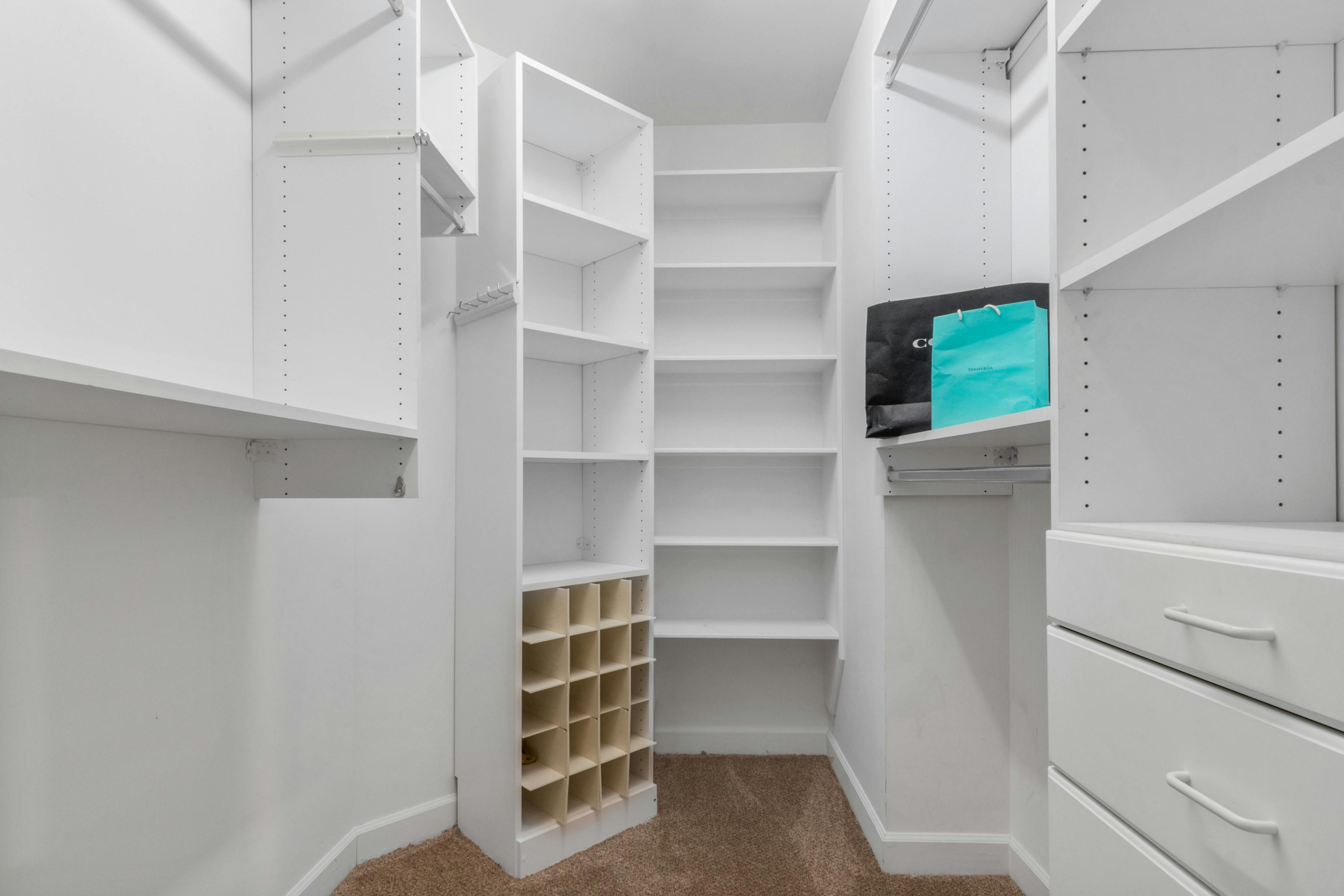Streamlined Organized Closet Setup Efficiently arranged wardrobe setup
