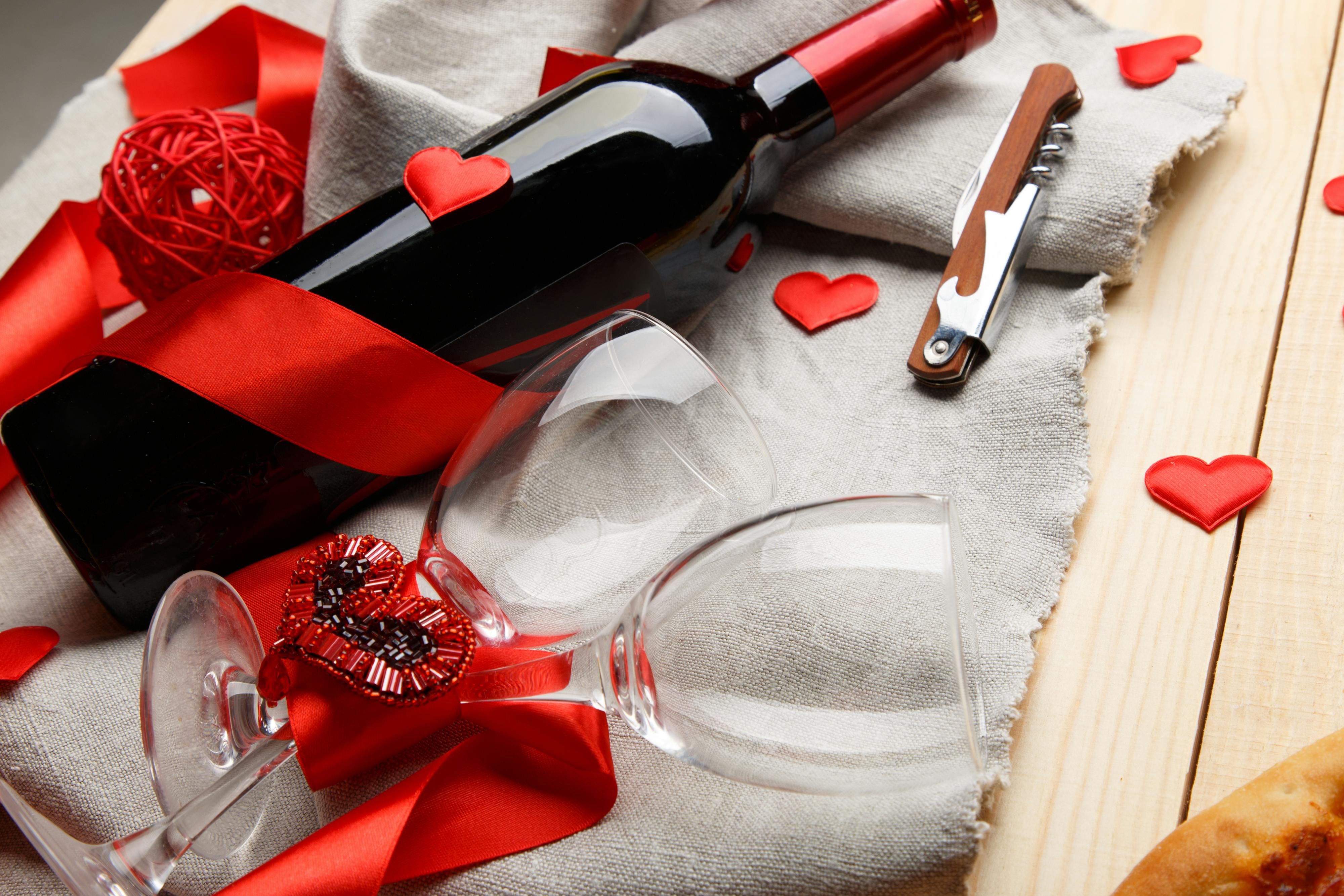 Wine bottle opener positioned alongside discarded corks Bottle opener for wine, with nearby corks displayed