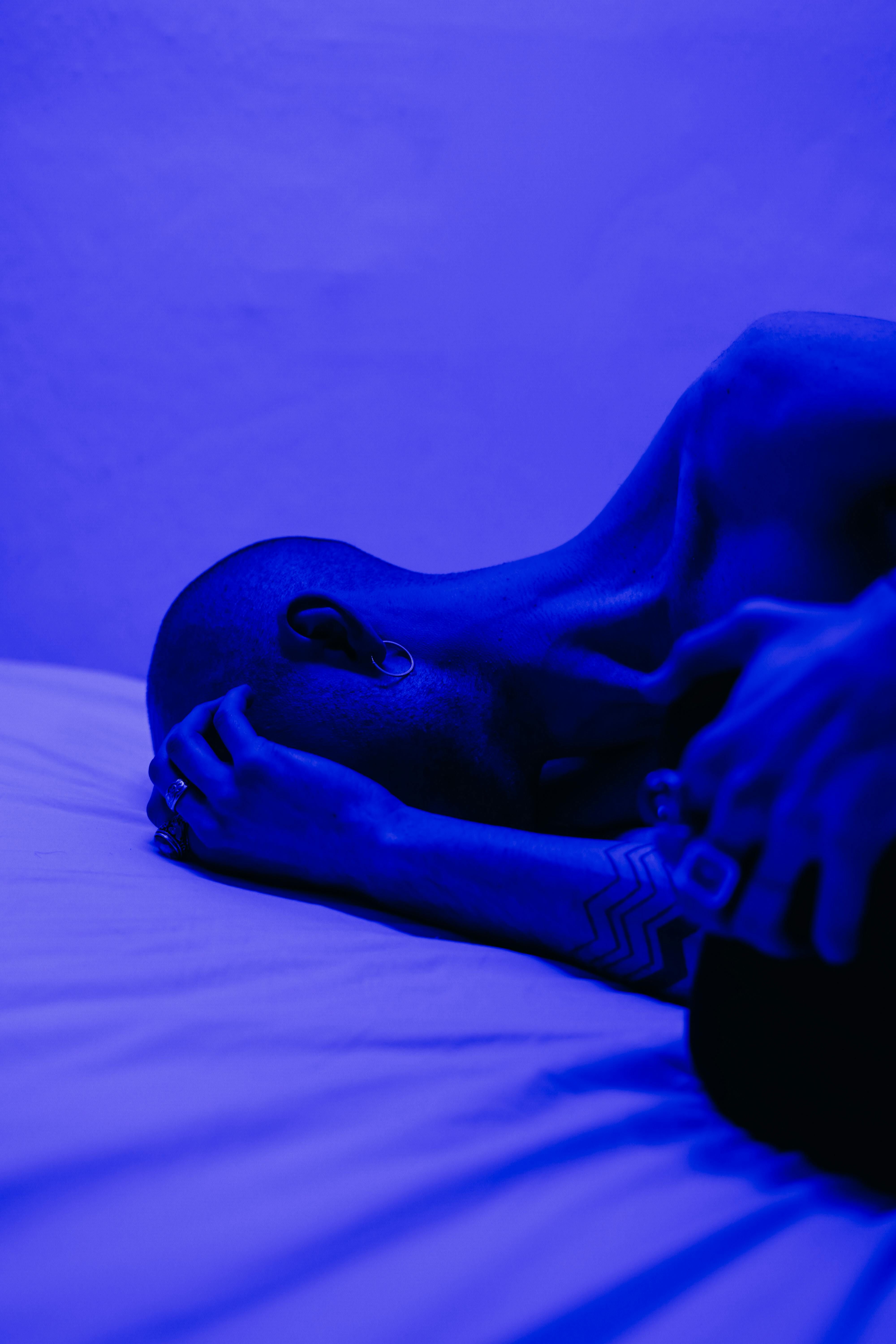 Image showing a shower head emitting light in a dark bathroom setting Image showing a shower head emitting a glow in a dim environment