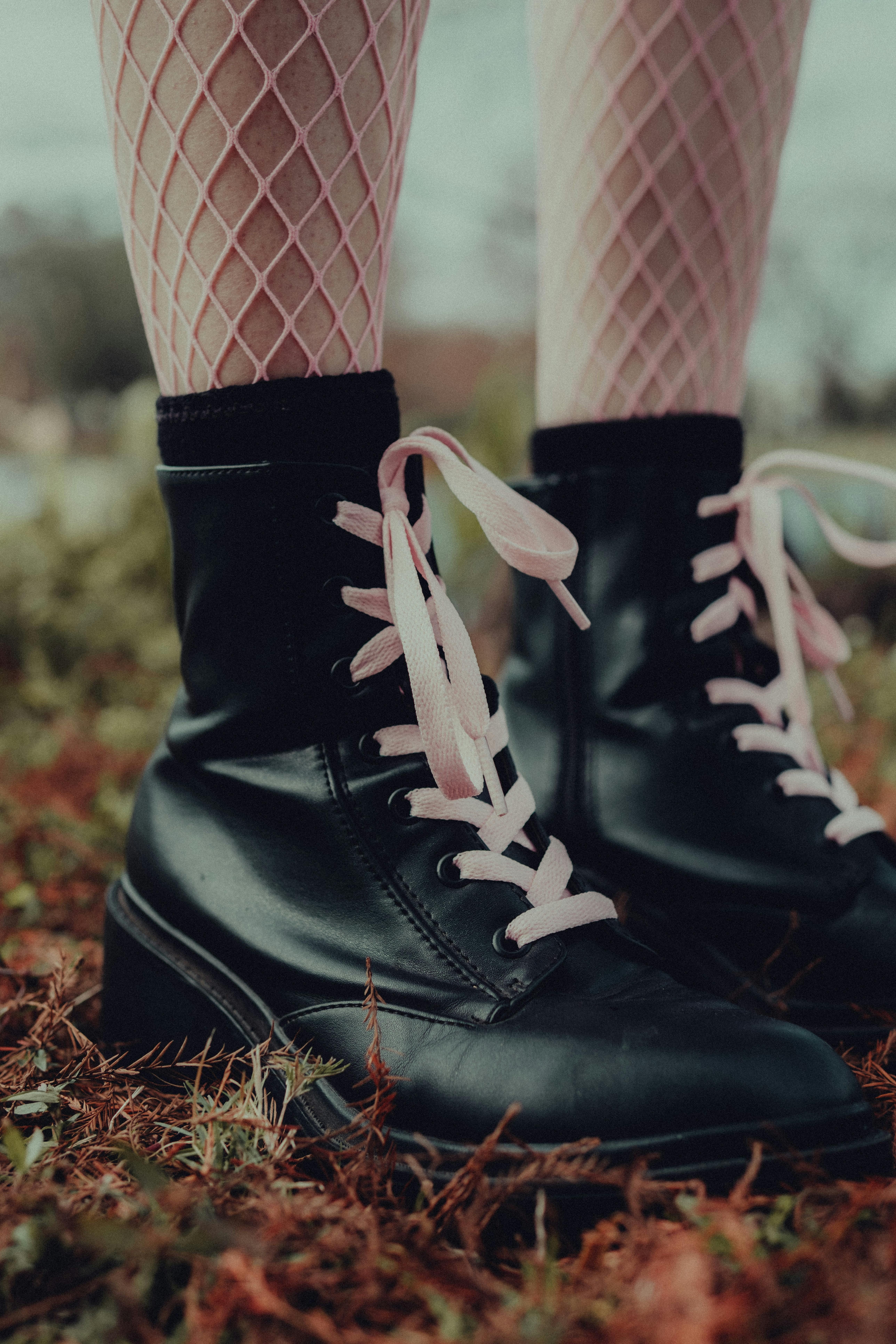 Dark brown ankle-length footwear with distinct stitching on the outside.