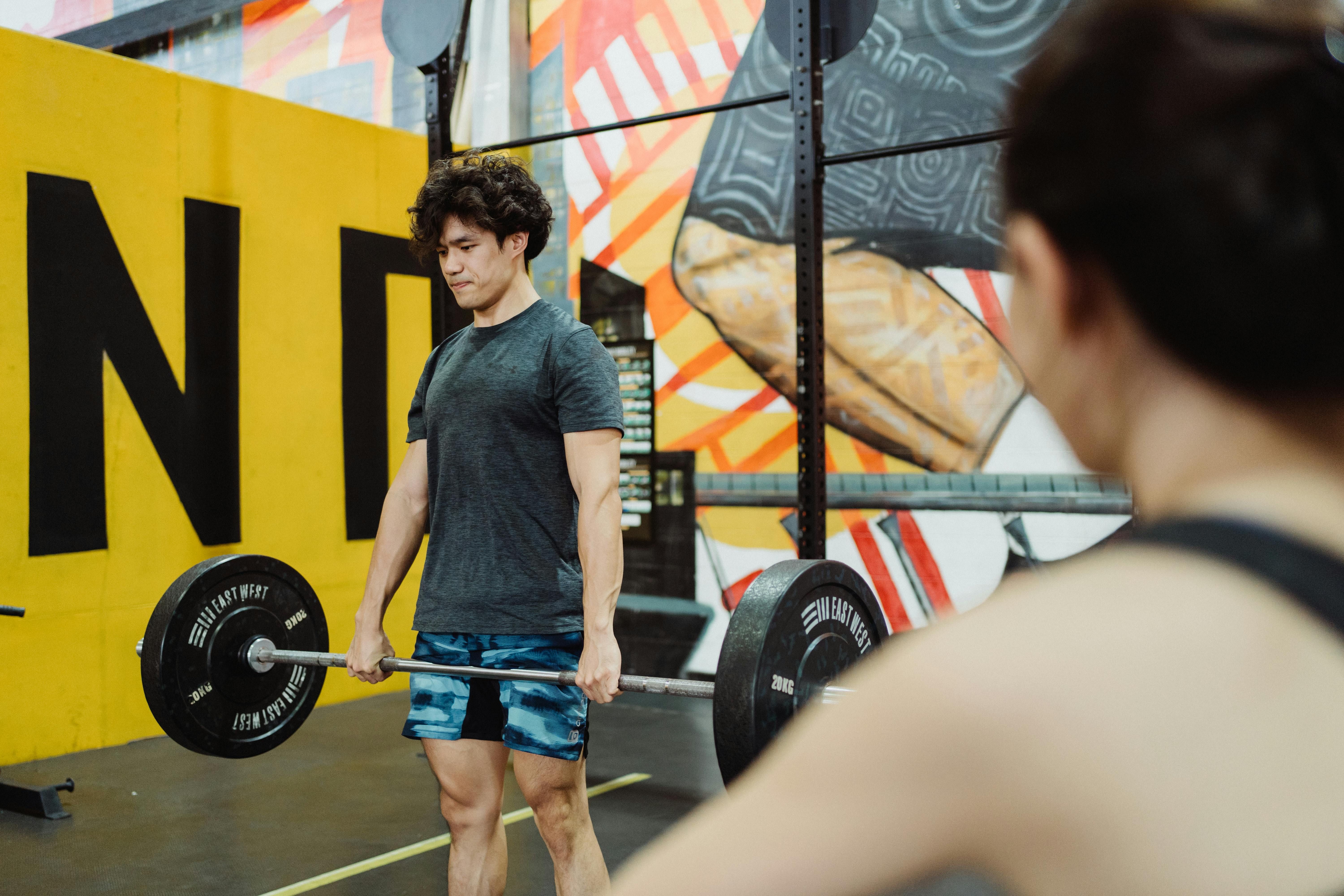 Gym-goer sports identical bicycle shorts during gym weightlifting sessions. Gym-goer sporting identical bike shorts for weightlifting sessions at fitness center