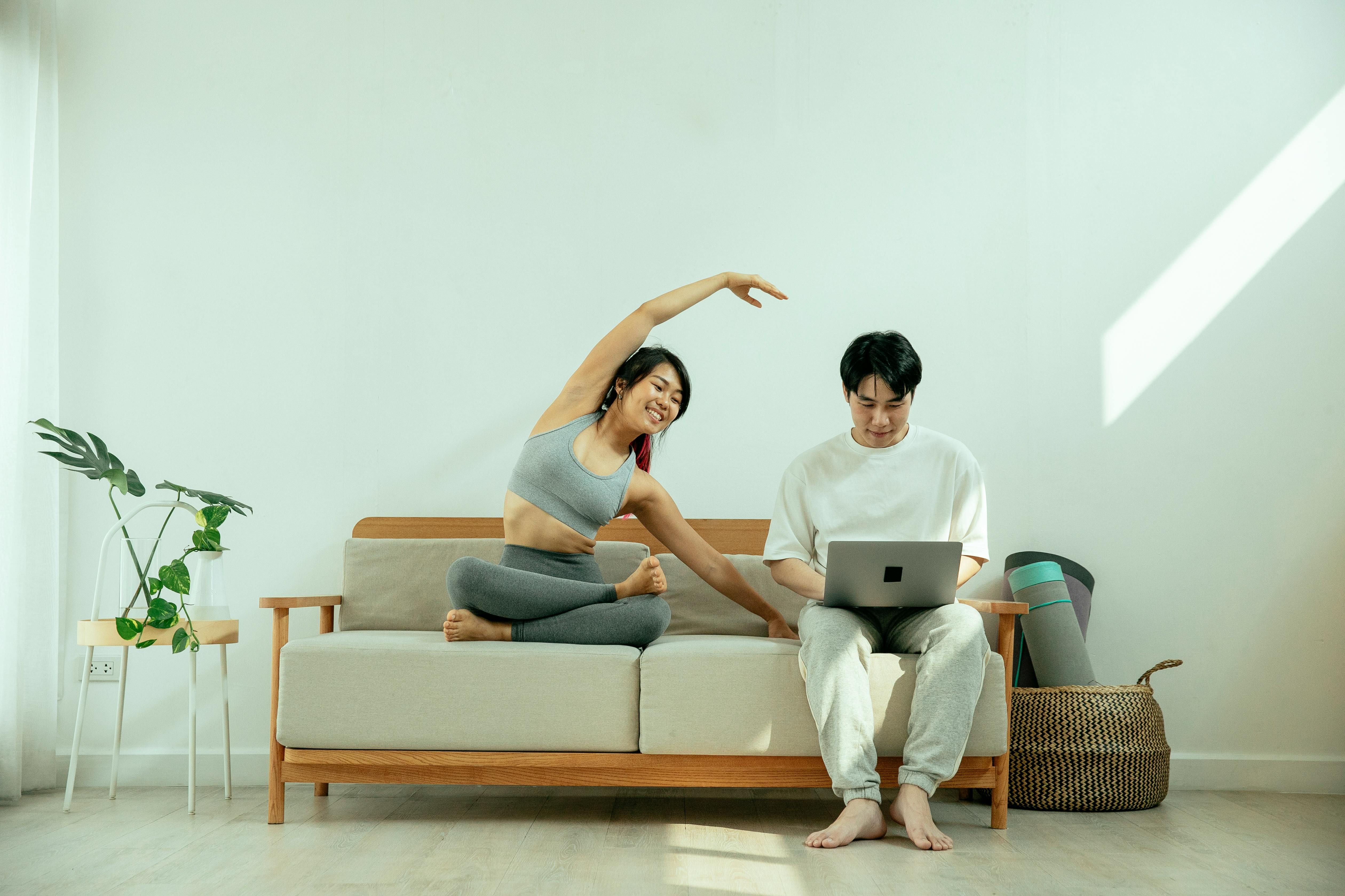 Individual optimizes fitness routine at home by incorporating Activbody Activ5 device underfoot during exercises Individual conducting home workout, utilizing Activbody Activ5 Training Gadget placed beneath foot.