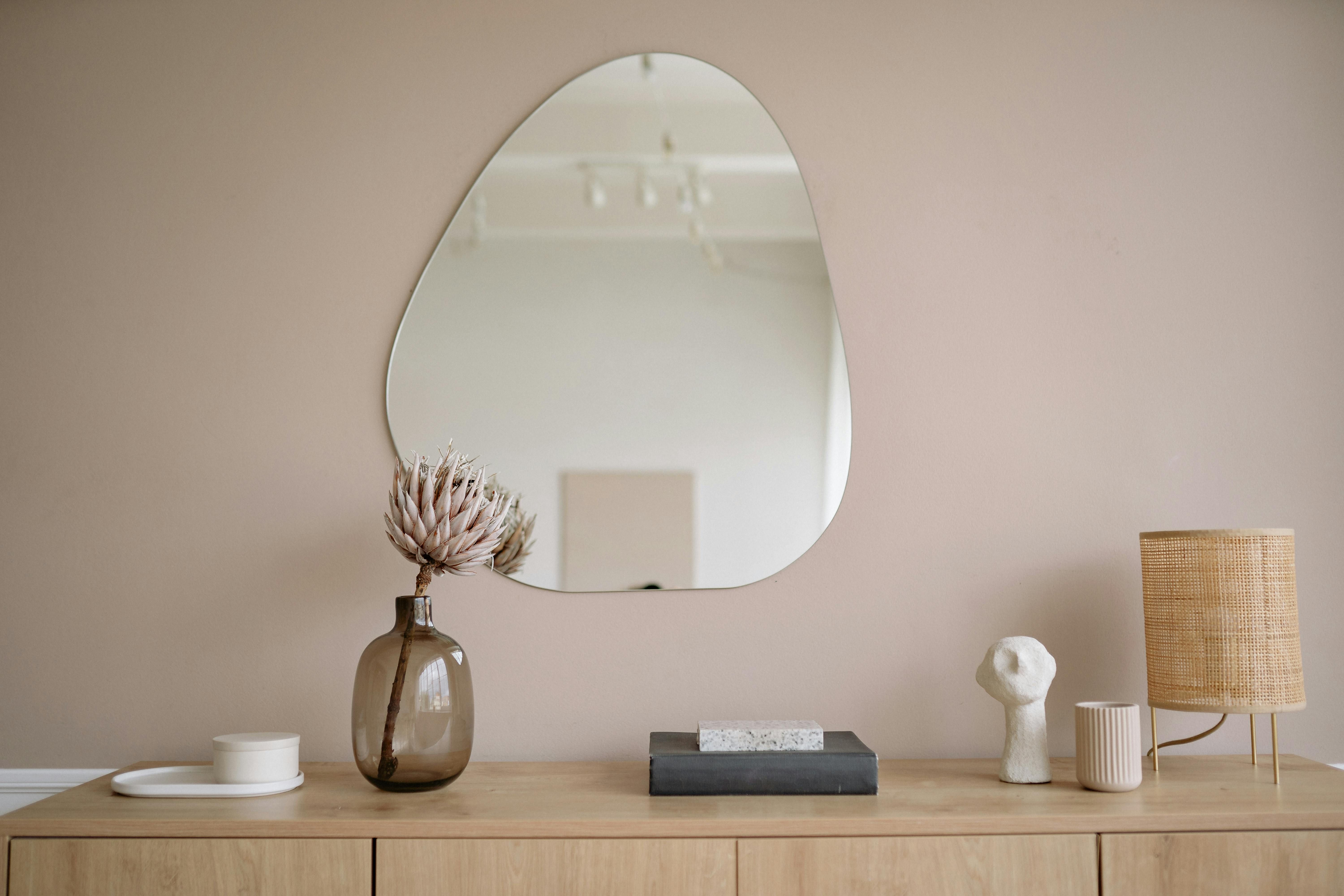 Decorative item of equal weight positioned on a wooden shelf at home Wooden shelf holds identical weight as home design accent