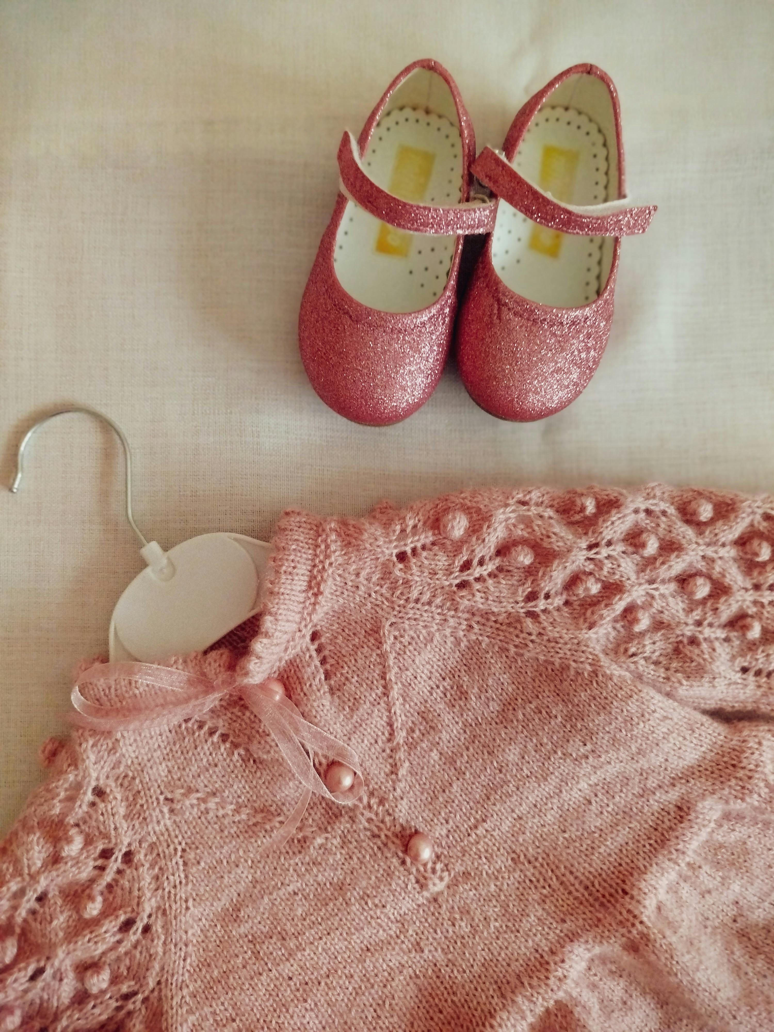 Individual at baby shower donned pink gown Attendee adorned in pink gown at baby shower event