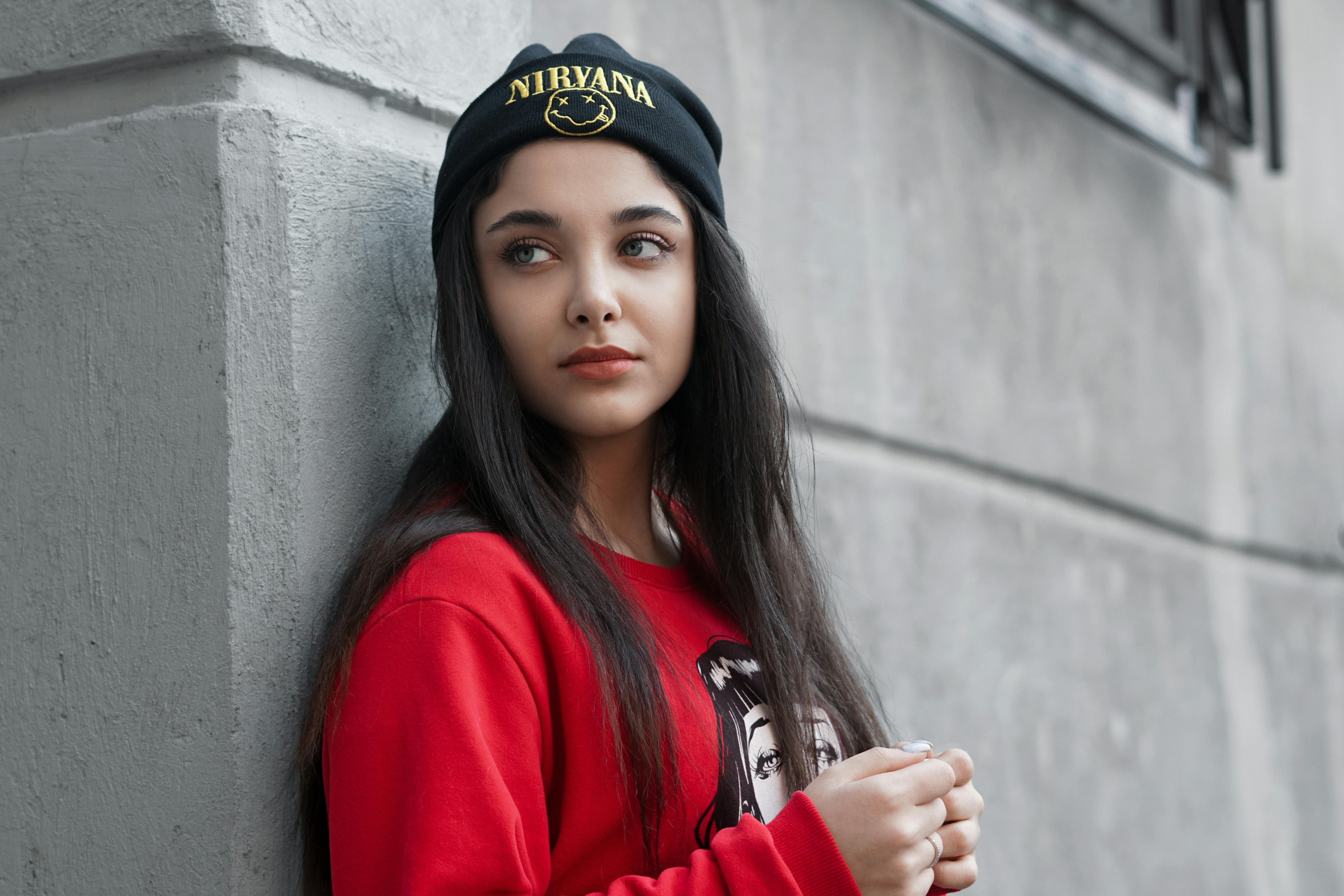 Individual Wearing Carhartt-Branded Beanie Offers Critique Examiner donning a gray Carhartt-branded foldover beanie scrutinizes product