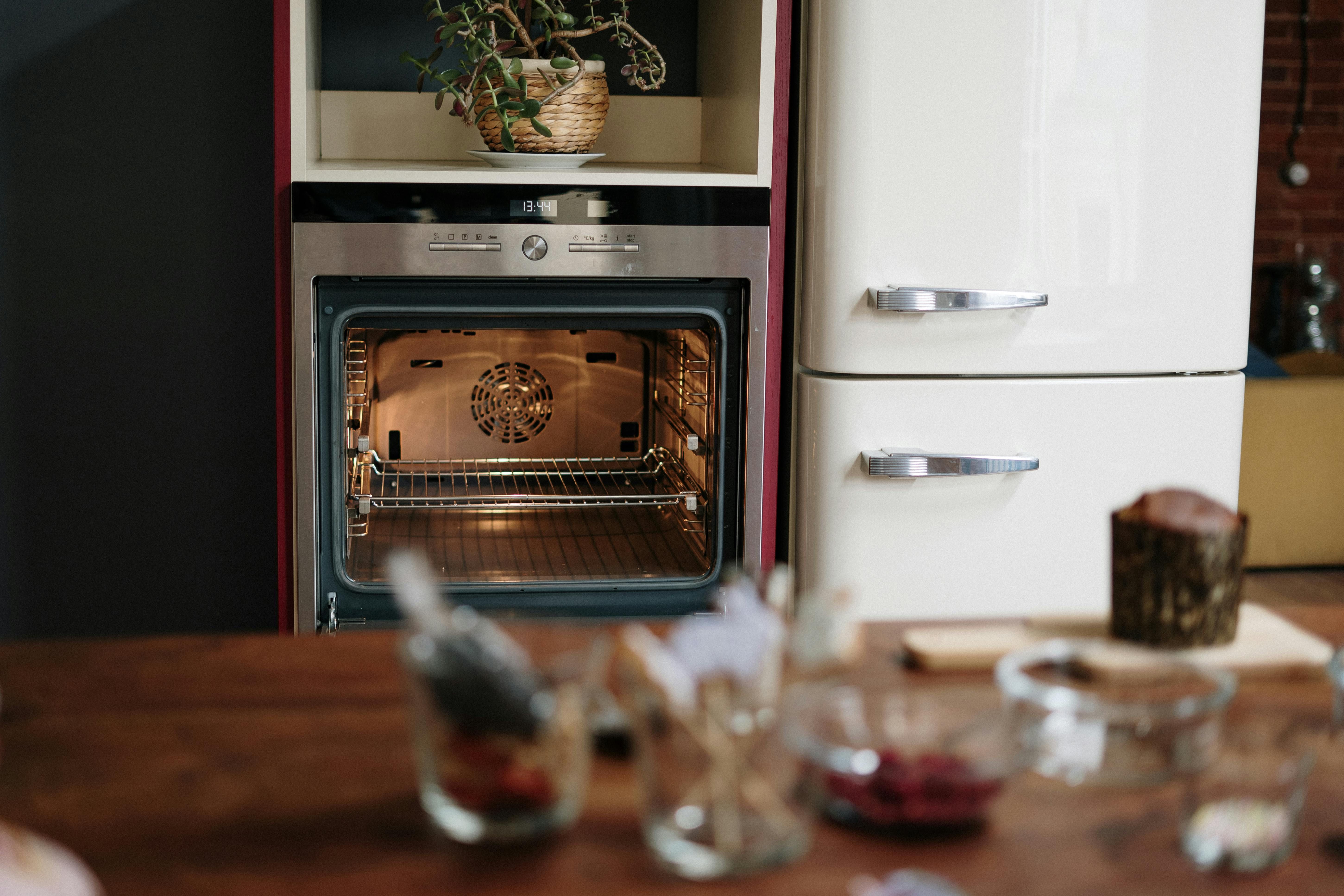 The silver refrigerator serves as a spacious, sunlit chamber. A naturally lit, silver-colored refrigerator serves as an open space.