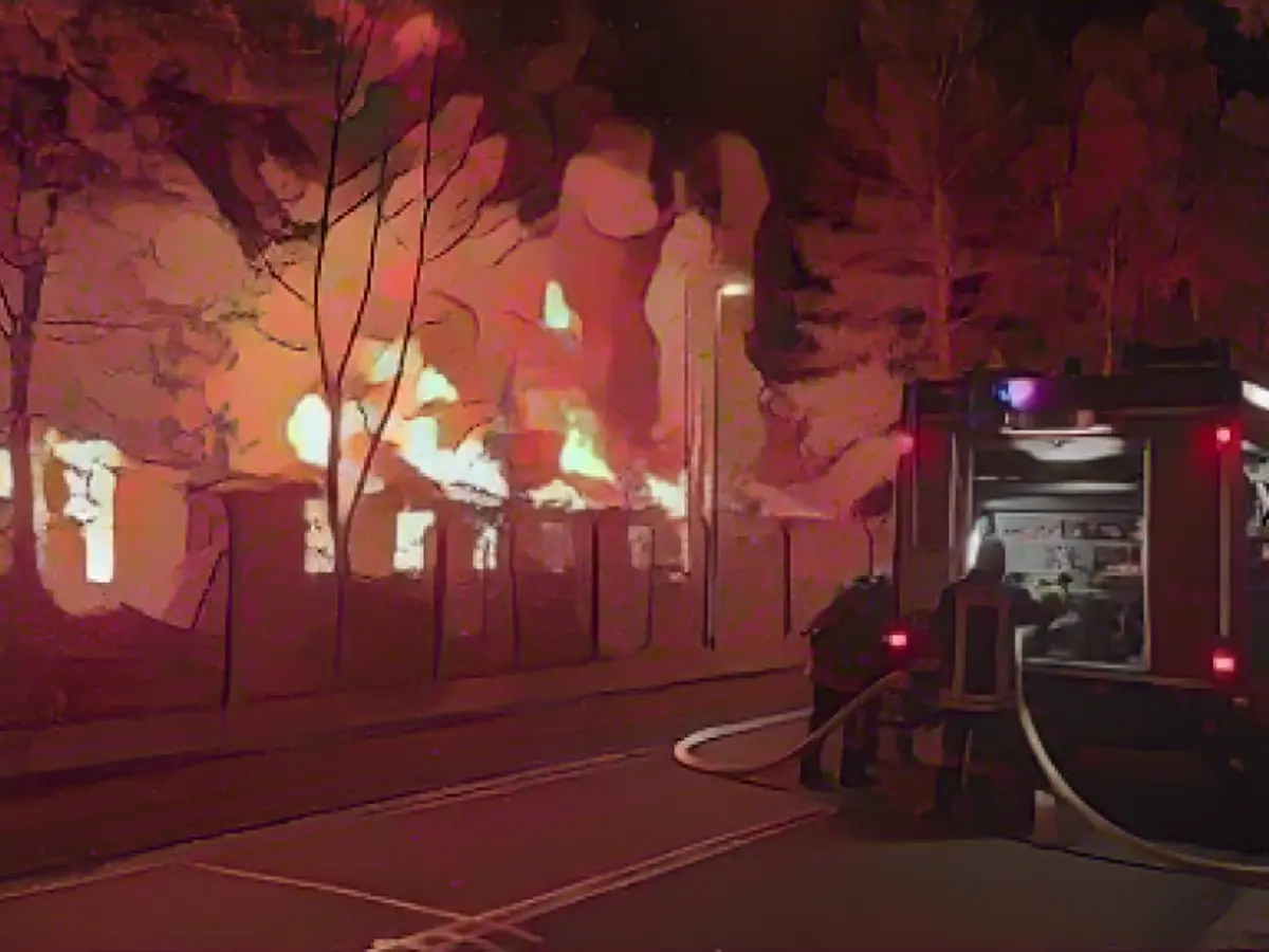 Former youth village building in flames