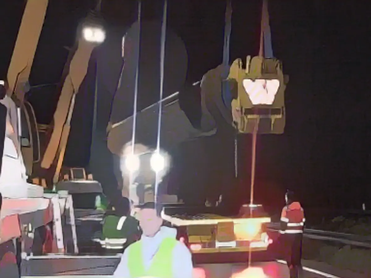 Here they pull the monster crane off the asphalt