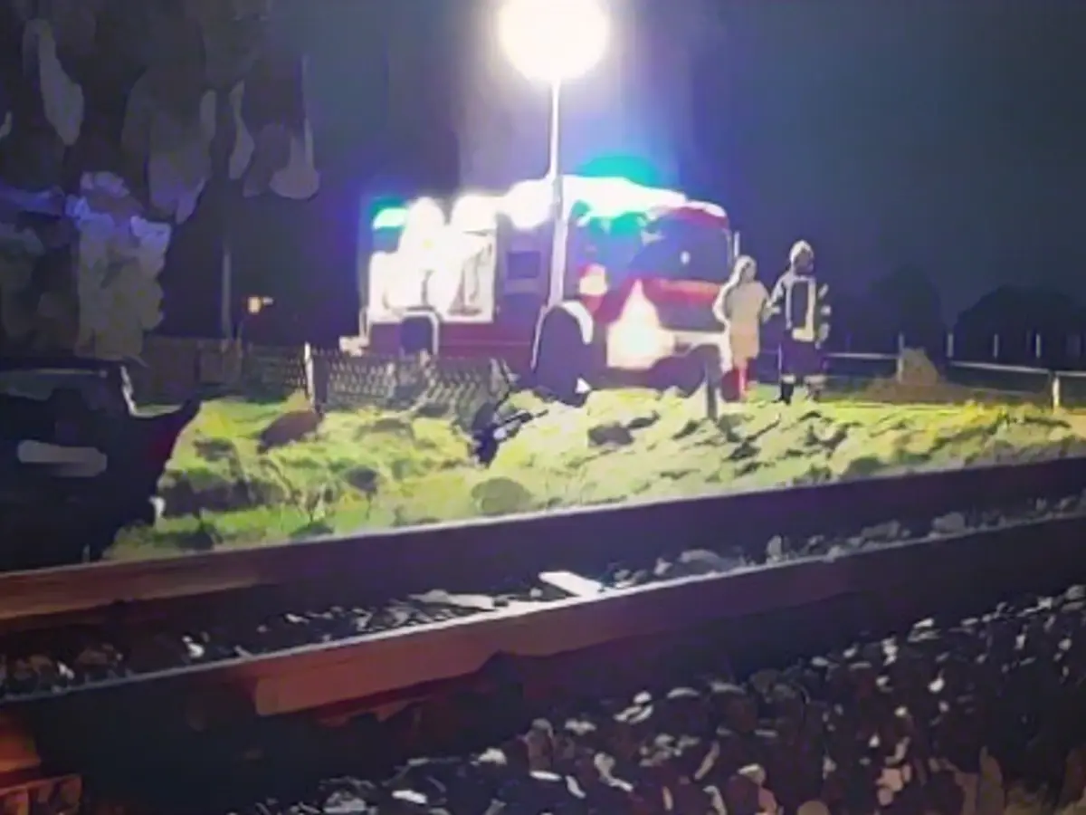 Train rams car off the tracks