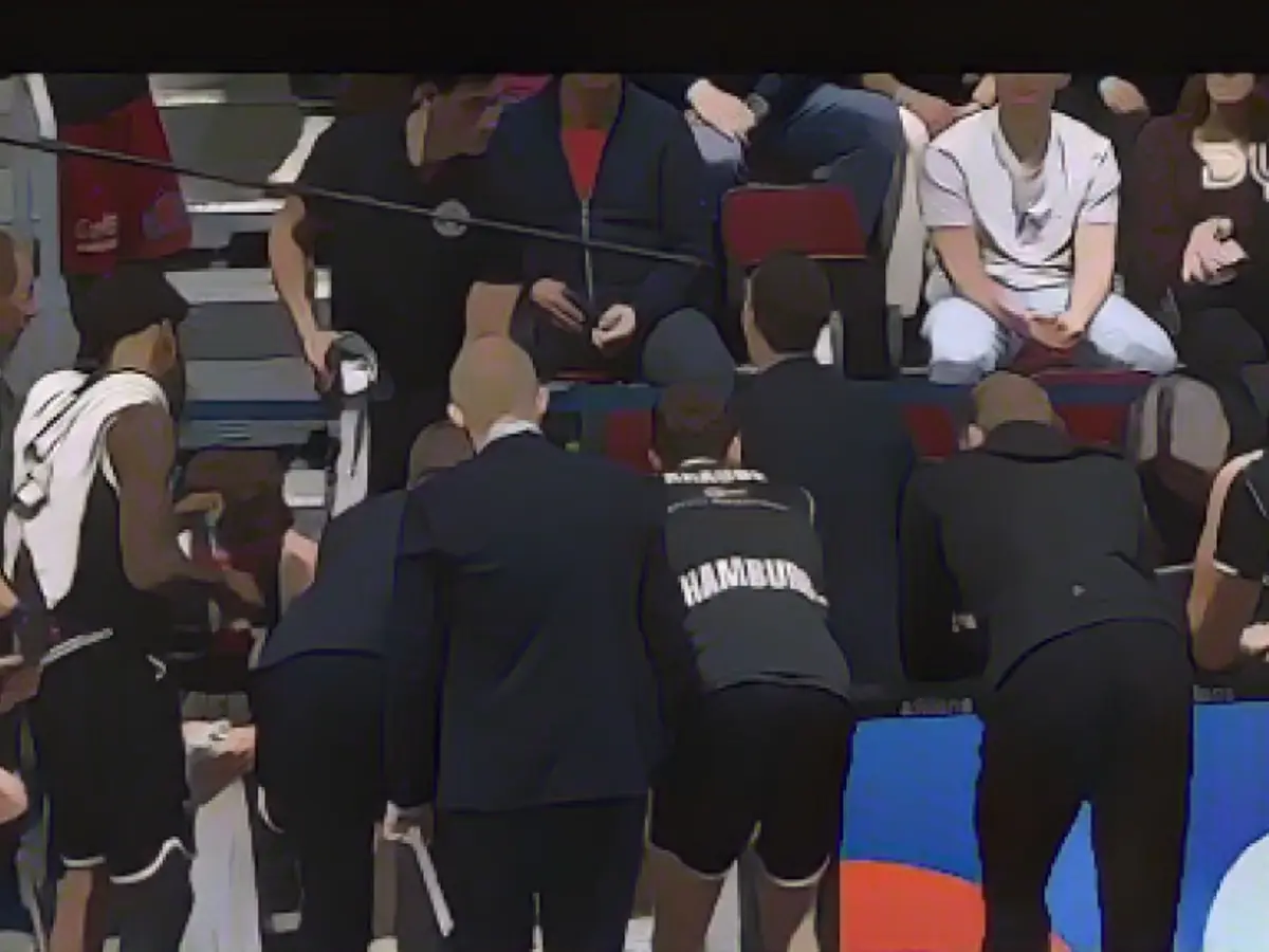 Suddenly the coach shouts "Fuck them!" into the microphone