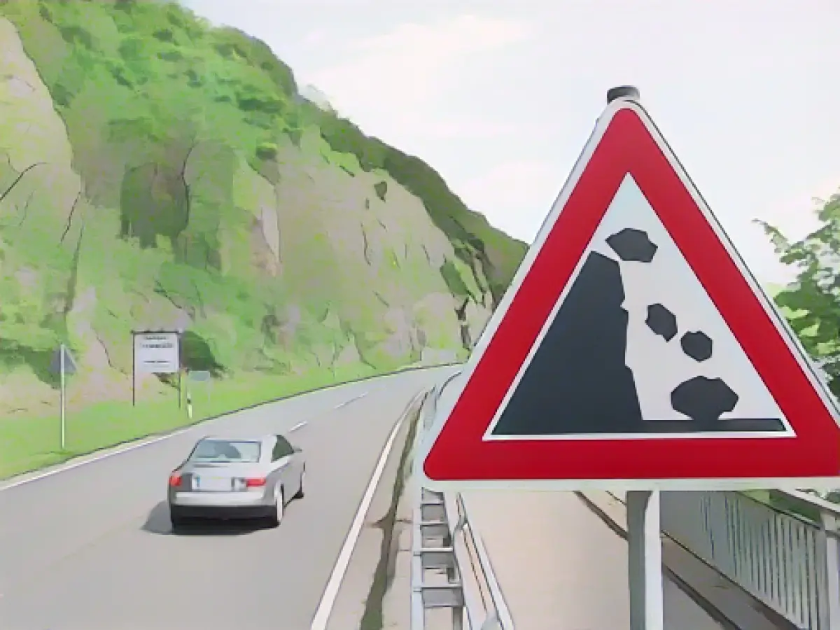 200 kilogram rock falls onto car