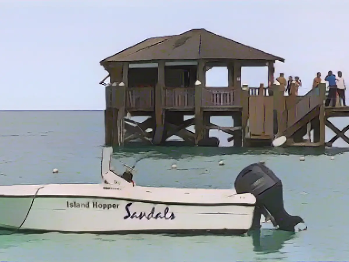 A Boston woman died after a shark attack while boating near a resort in the Bahamas, police said