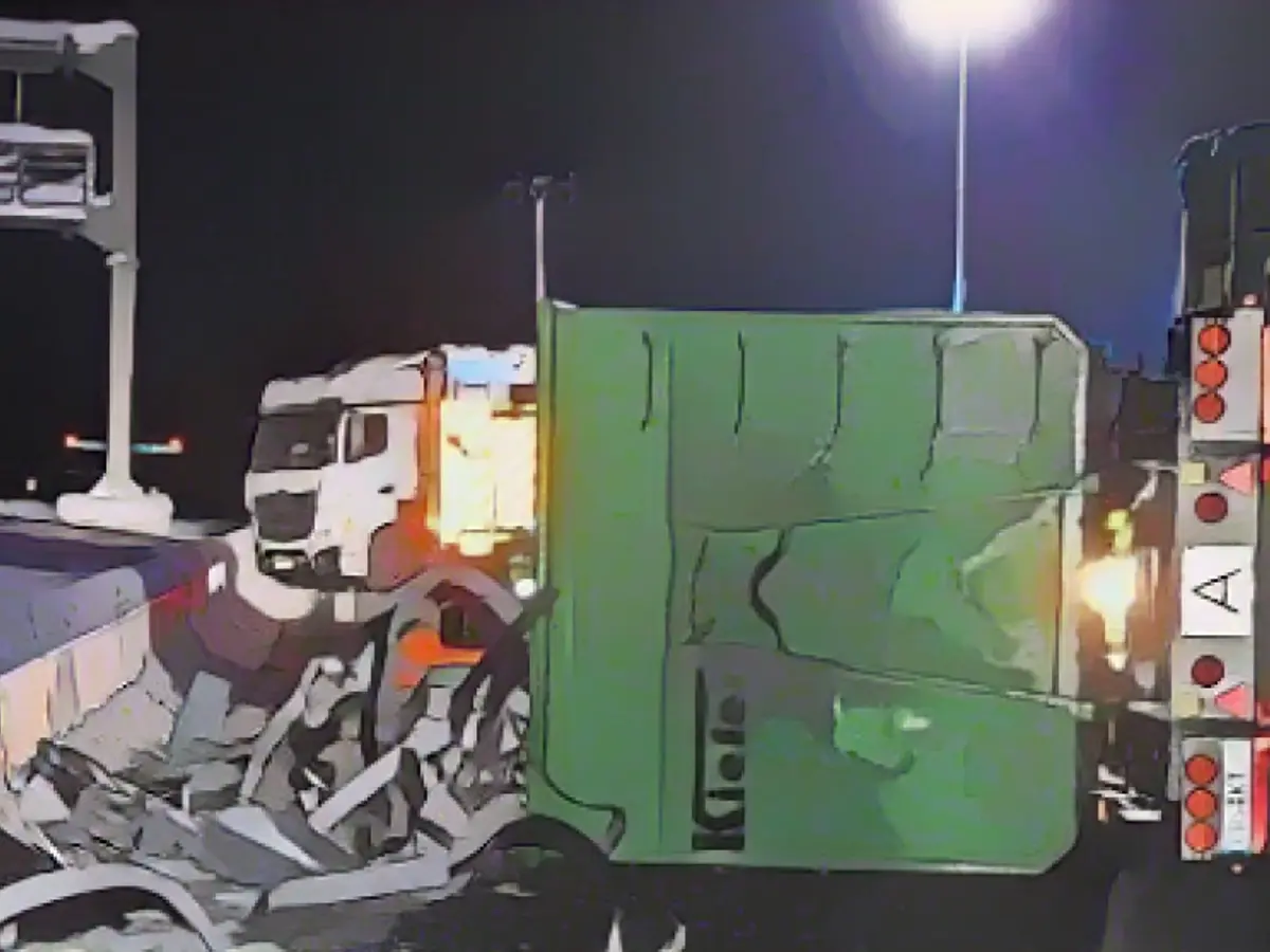 Car crashes into a stationary truck in icy conditions