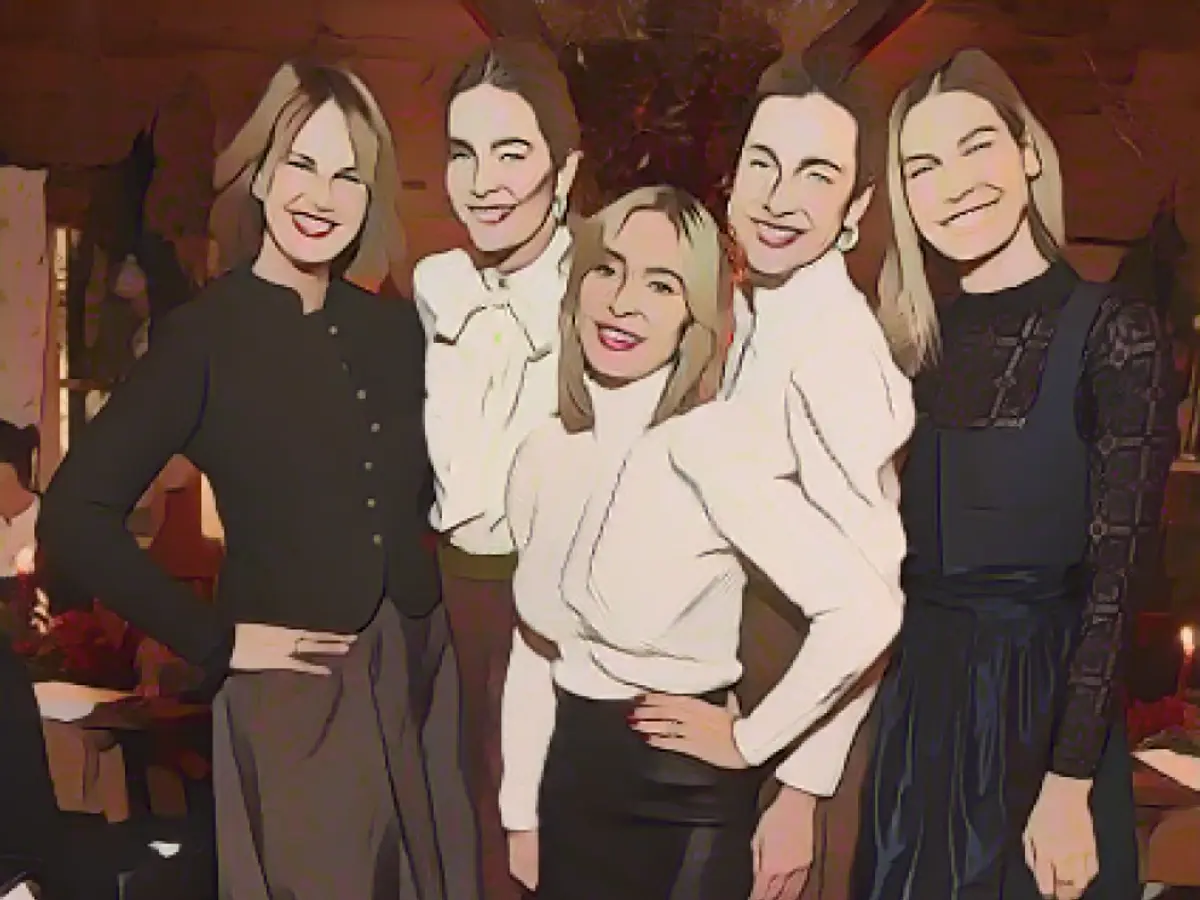 Designer celebrates in style and with a check