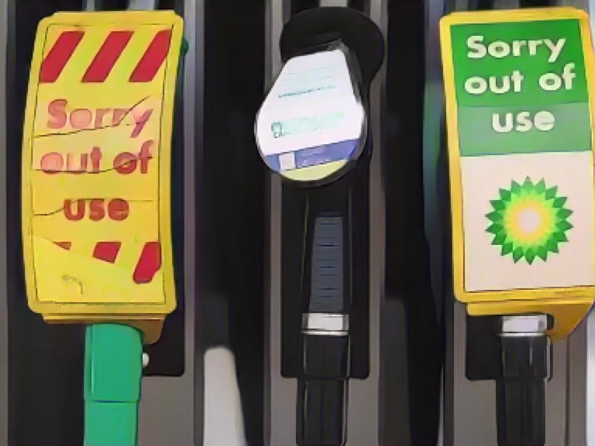 BP closes some petrol stations as Britons queue to fill up