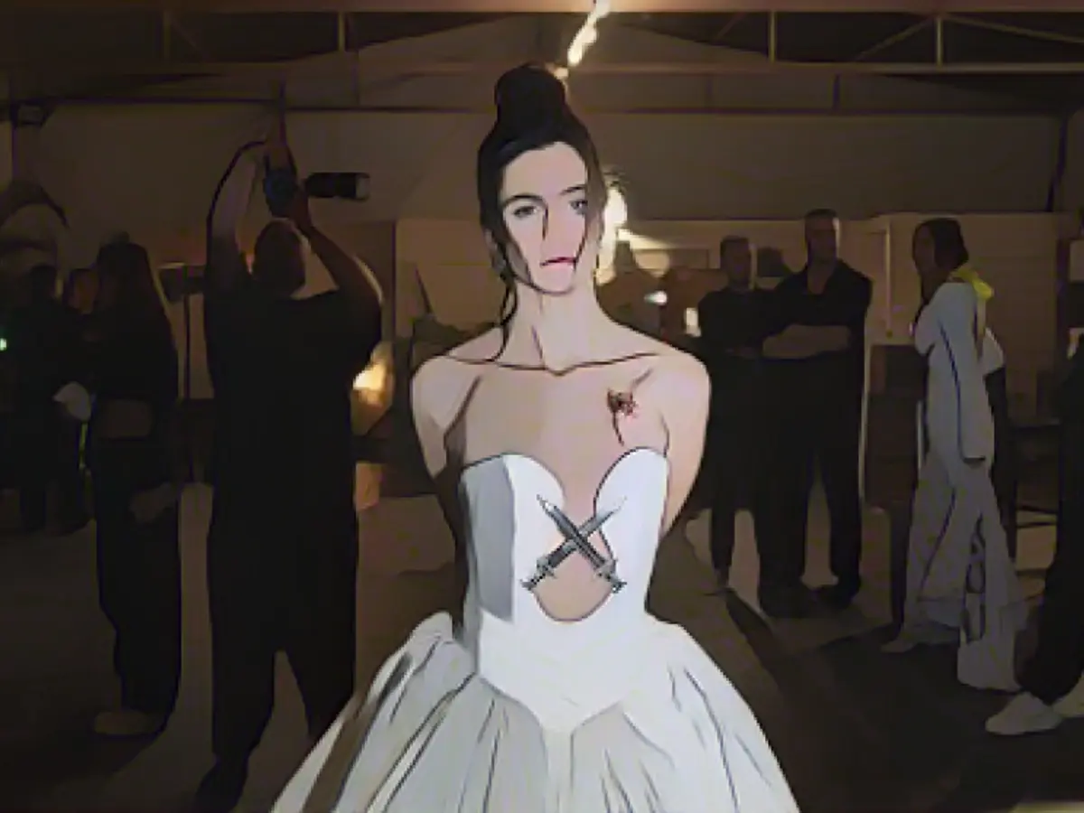 Bride takes to the catwalk with a gunshot wound