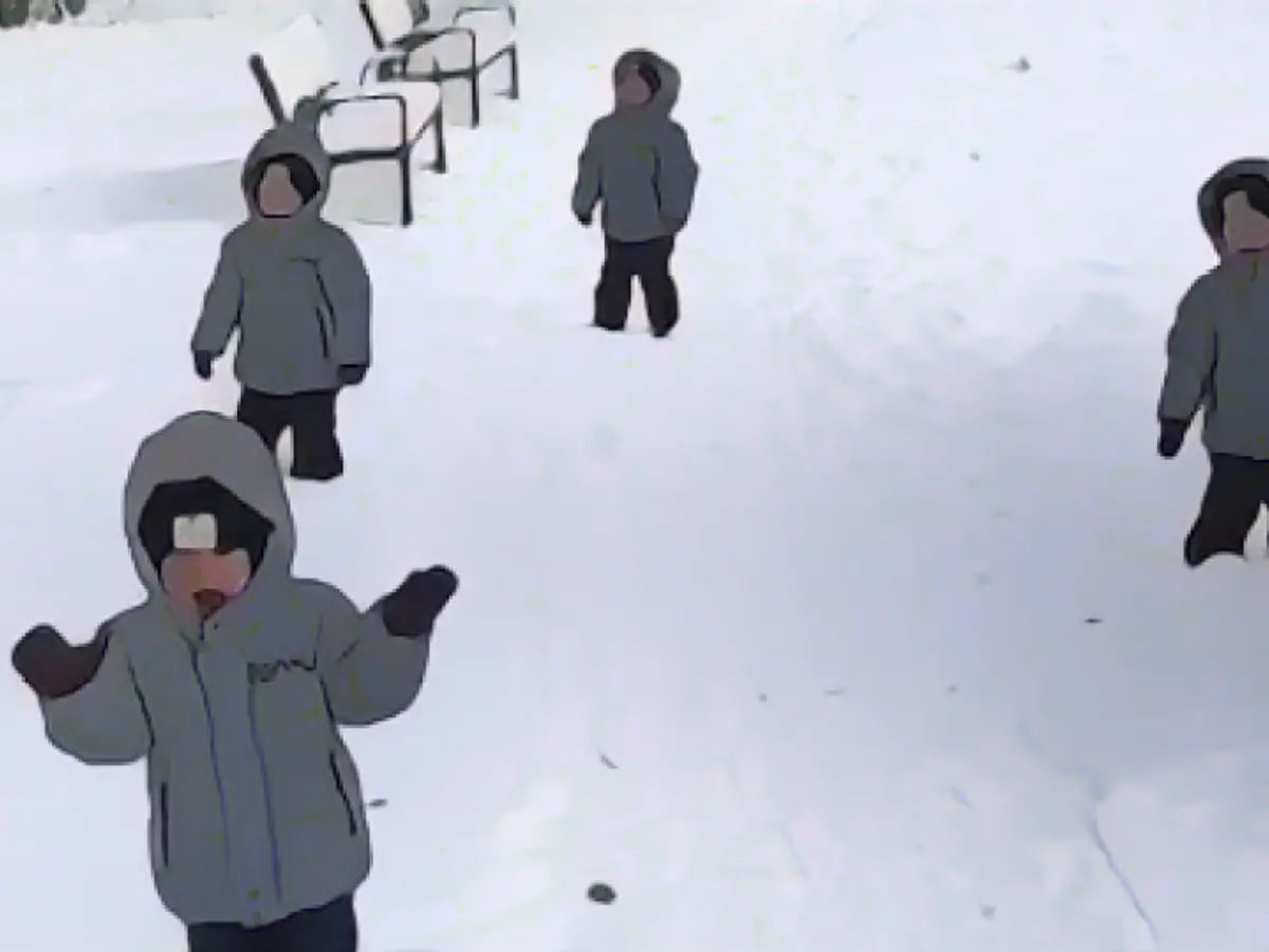 Quadruplets experience their first snow - and hate it