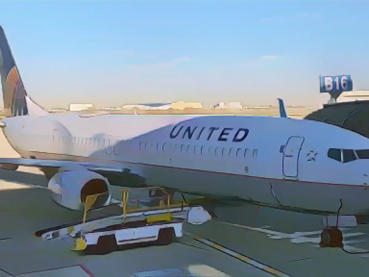 Passenger arrested after opening emergency exit and walking on wing