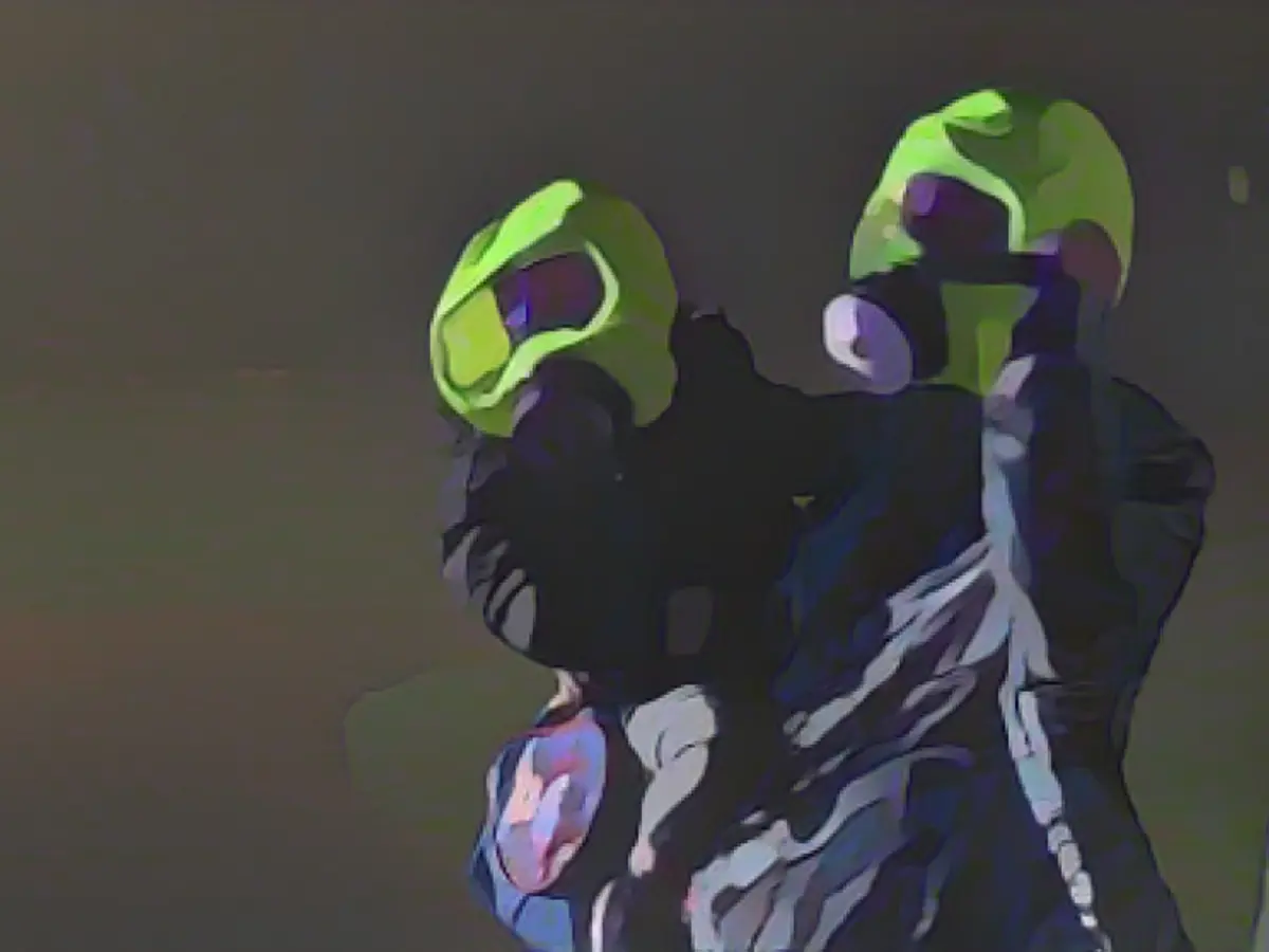 Protective hood saves mother and toddler in fire house