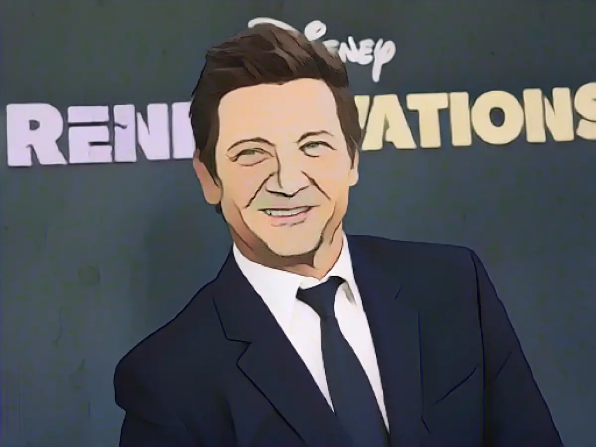 Jeremy Renner jogs and hops ten months after serious accident