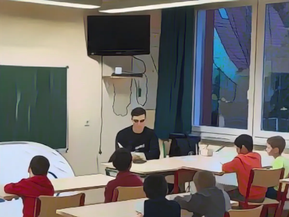 Professional handball player reads to first graders