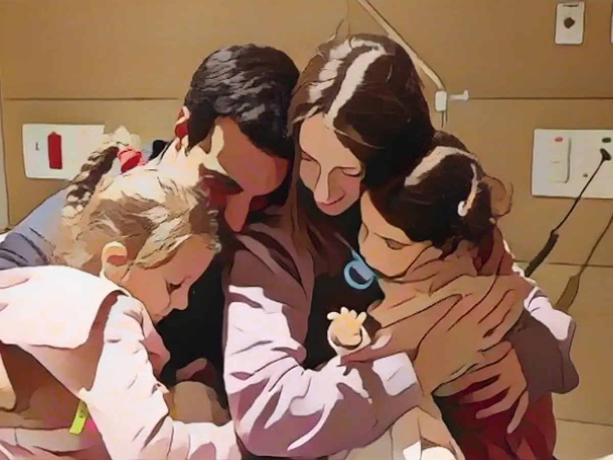 Father embraces daughters and wife released by Hamas